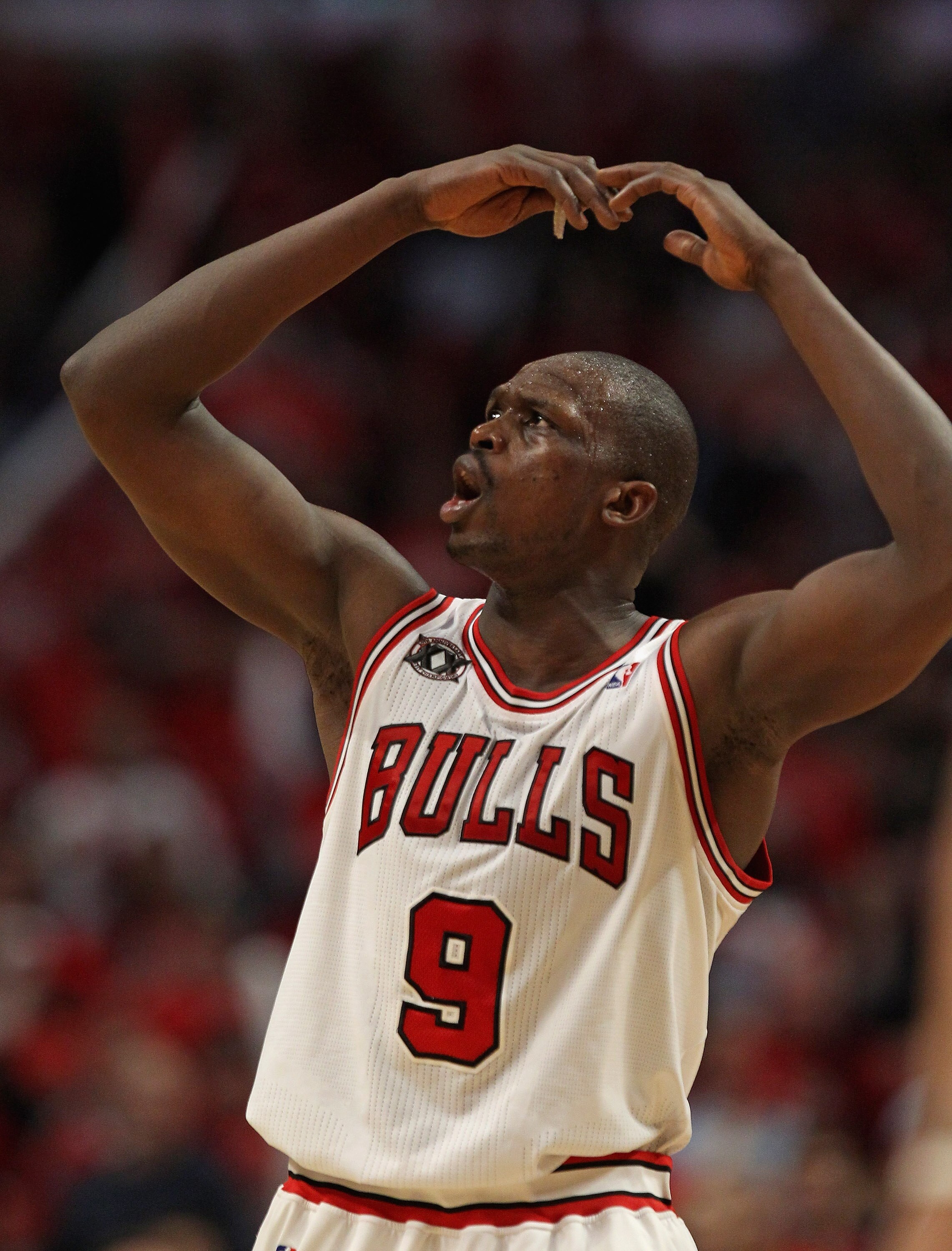 CHICAGO, IL - APRIL 16: Loul Deng #9 of the Chicago Bulls encourages the crowd to cheer in the 4th quarter against the Indiana Pacers in Game One of the Eastern Conference Quarterfinals in the 2011 NBA Playoffs at the United Center on April 16, 2011 in Ch
