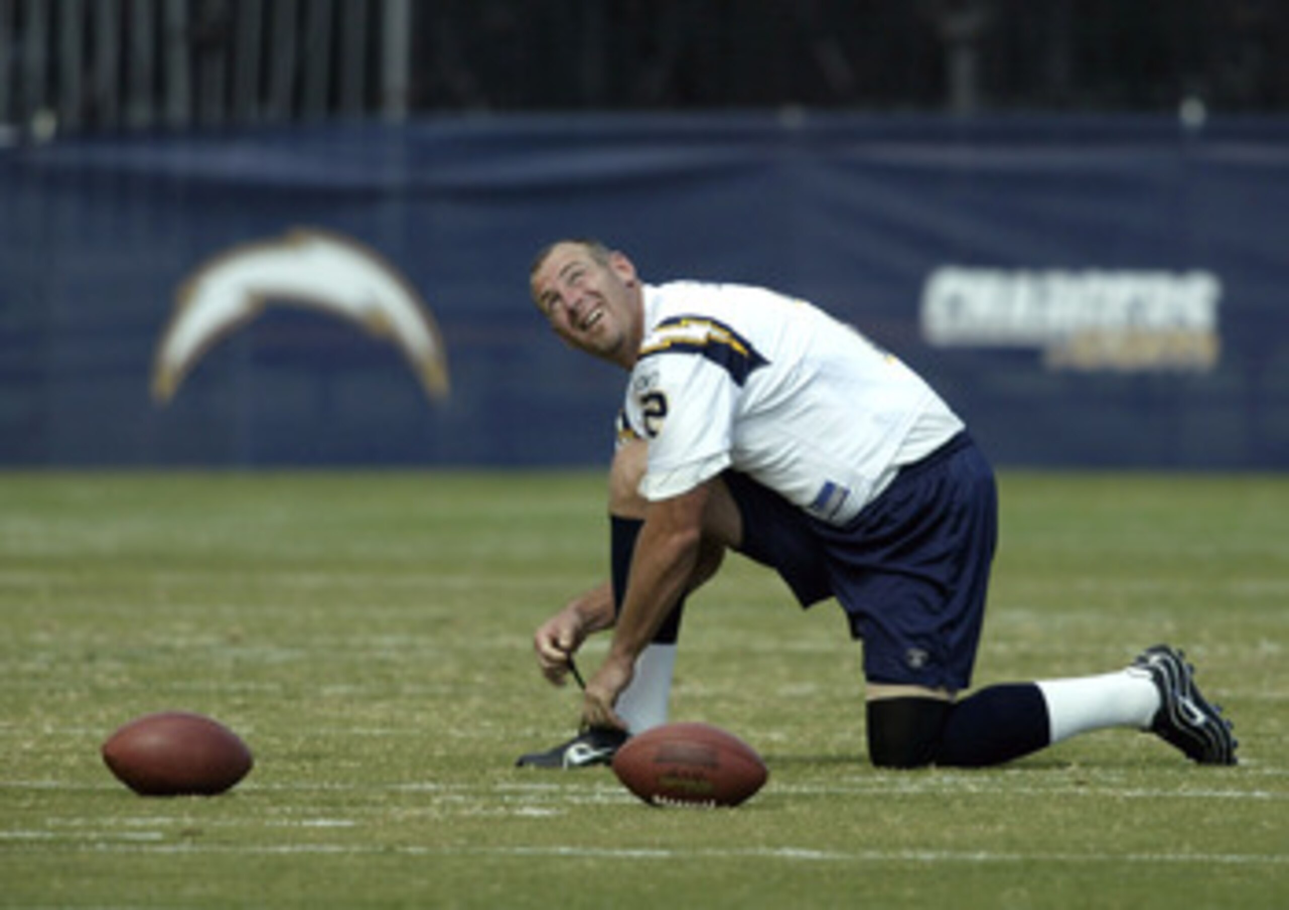 CARSON, CA - JULY 29:  Punter Darren Bennett #2 of San Diego Chargers glances up as he ties his shoe during a break at Chargers' training camp July 29, 2003 at the Home Depot Center in Carson, California.  (Photo by Stephen Dunn/Getty Images)