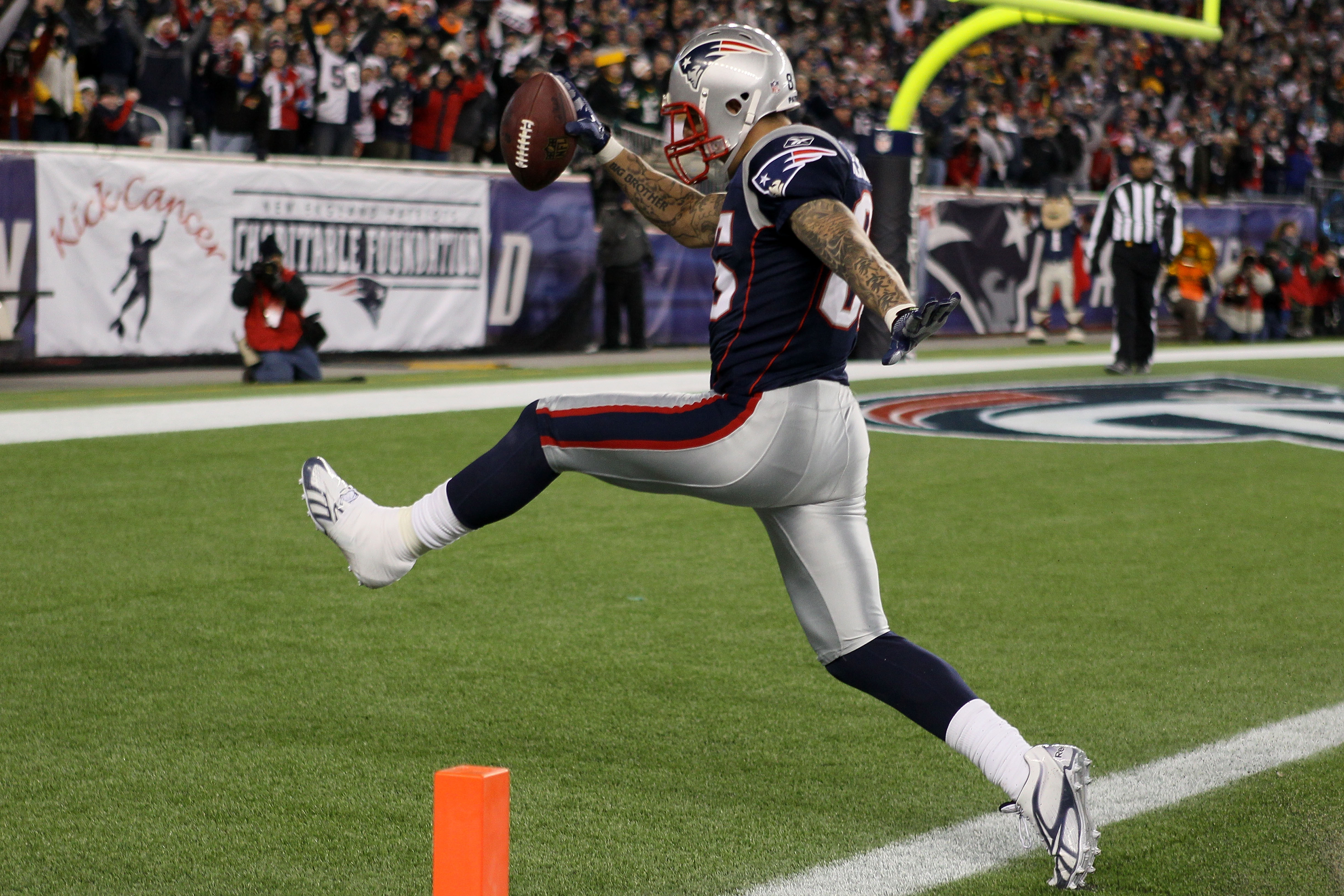 FOXBORO, MA - DECEMBER 19:  Tight end Aaron Hernandez #85 of the New England Patriots scores a touchdown after catching a pass from quarterback Tom Brady #12 (not pictured) in the fourth quarter of the game against the Green Bay Packers at Gillette Stadiu