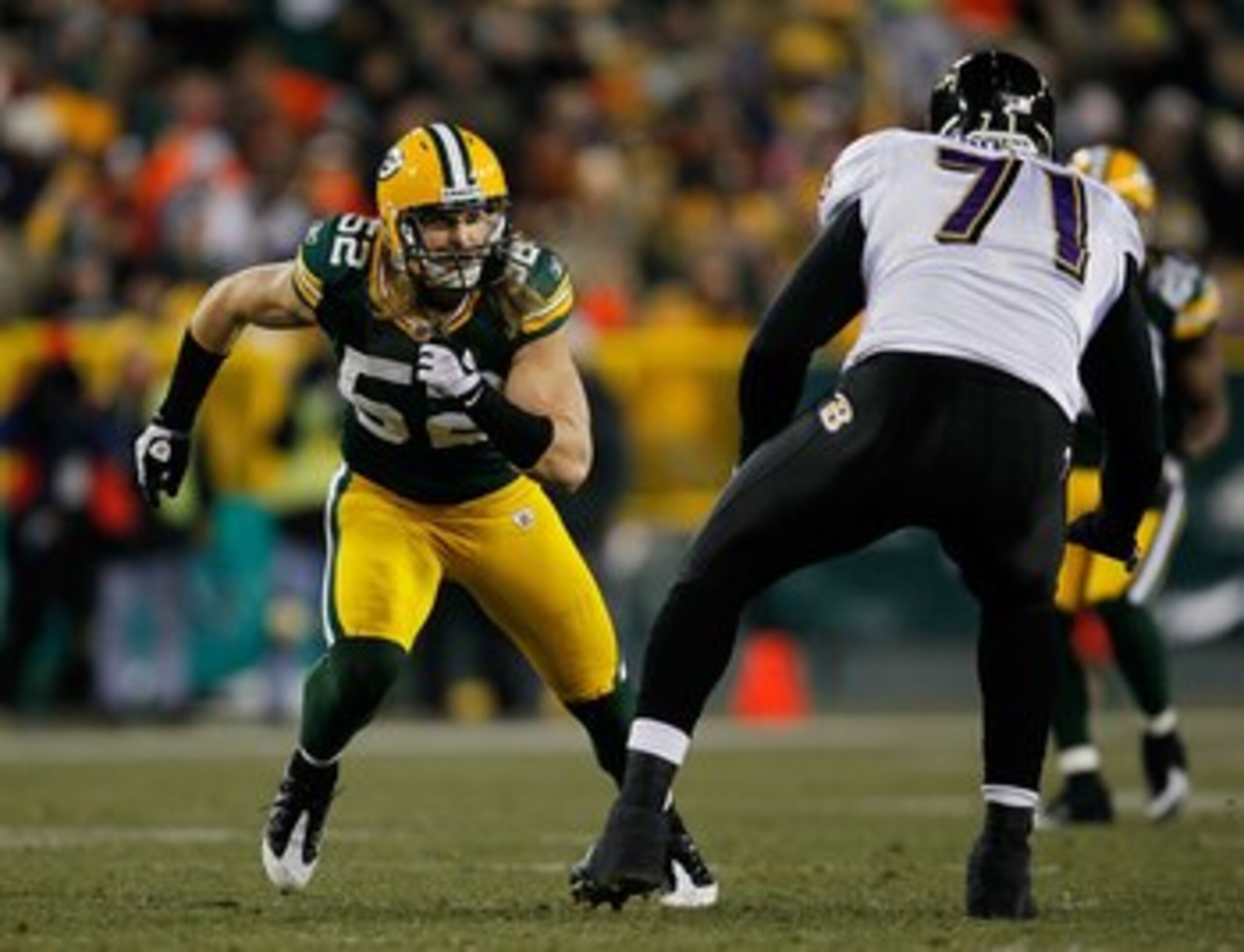 GREEN BAY, WI - DECEMBER 07: Clay Matthews #52 of the Green Bay Packers rushes against Jared Gaither #71 of the Baltimore Ravens at Lambeau Field on December 7, 2009 in Green Bay, Wisconsin. The Packers defeated the Ravens 27-17. (Photo by Jonathan Daniel