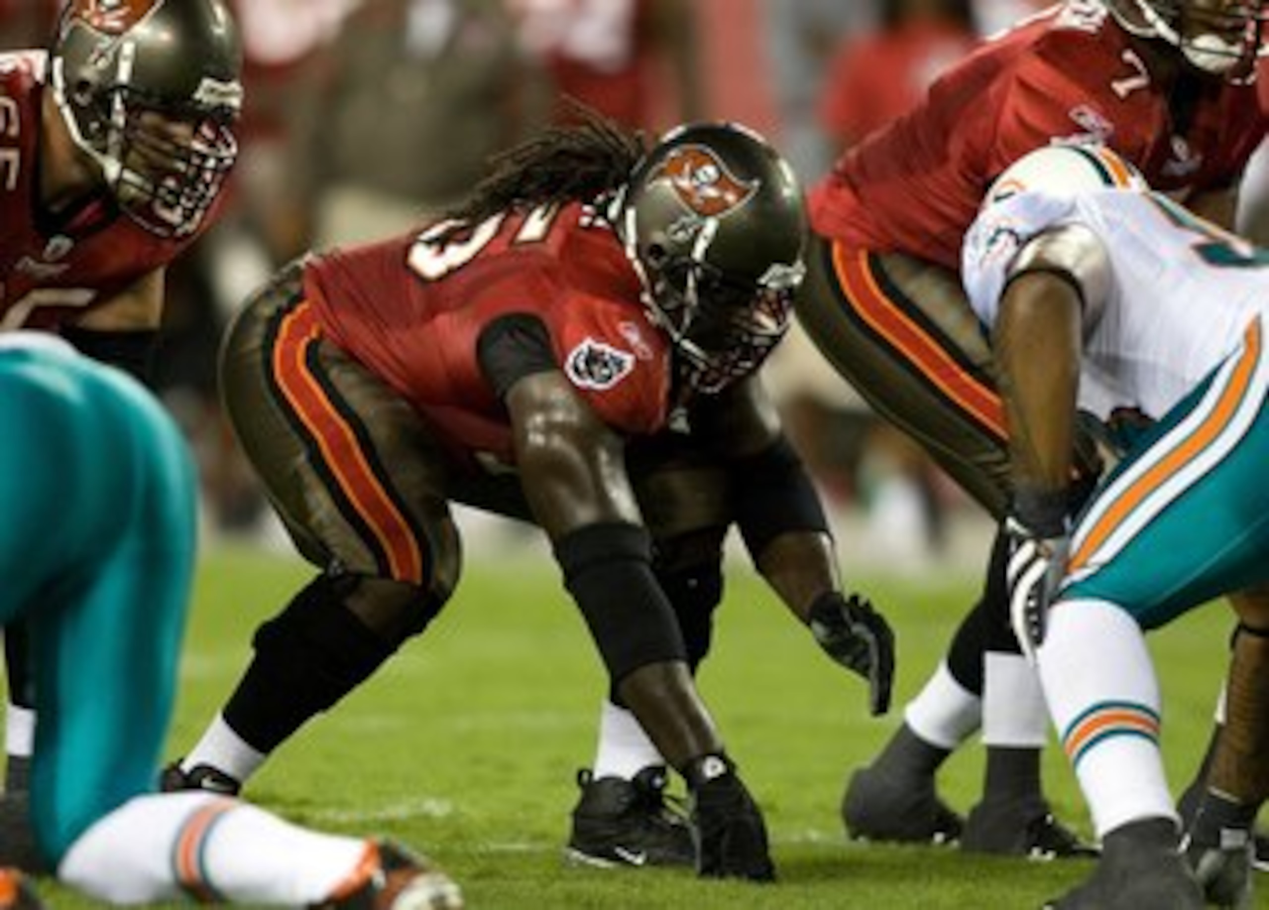 TAMPA, FL - AUGUST 27:  Offensive lineman Davin Joseph #75 of the Tampa Bay Buccaneers lines up against the Miami Dolphins during a preseason game at Raymond James Stadium on August 27, 2009 in Tampa, Florida.  (Photo by J. Meric/Getty Images)