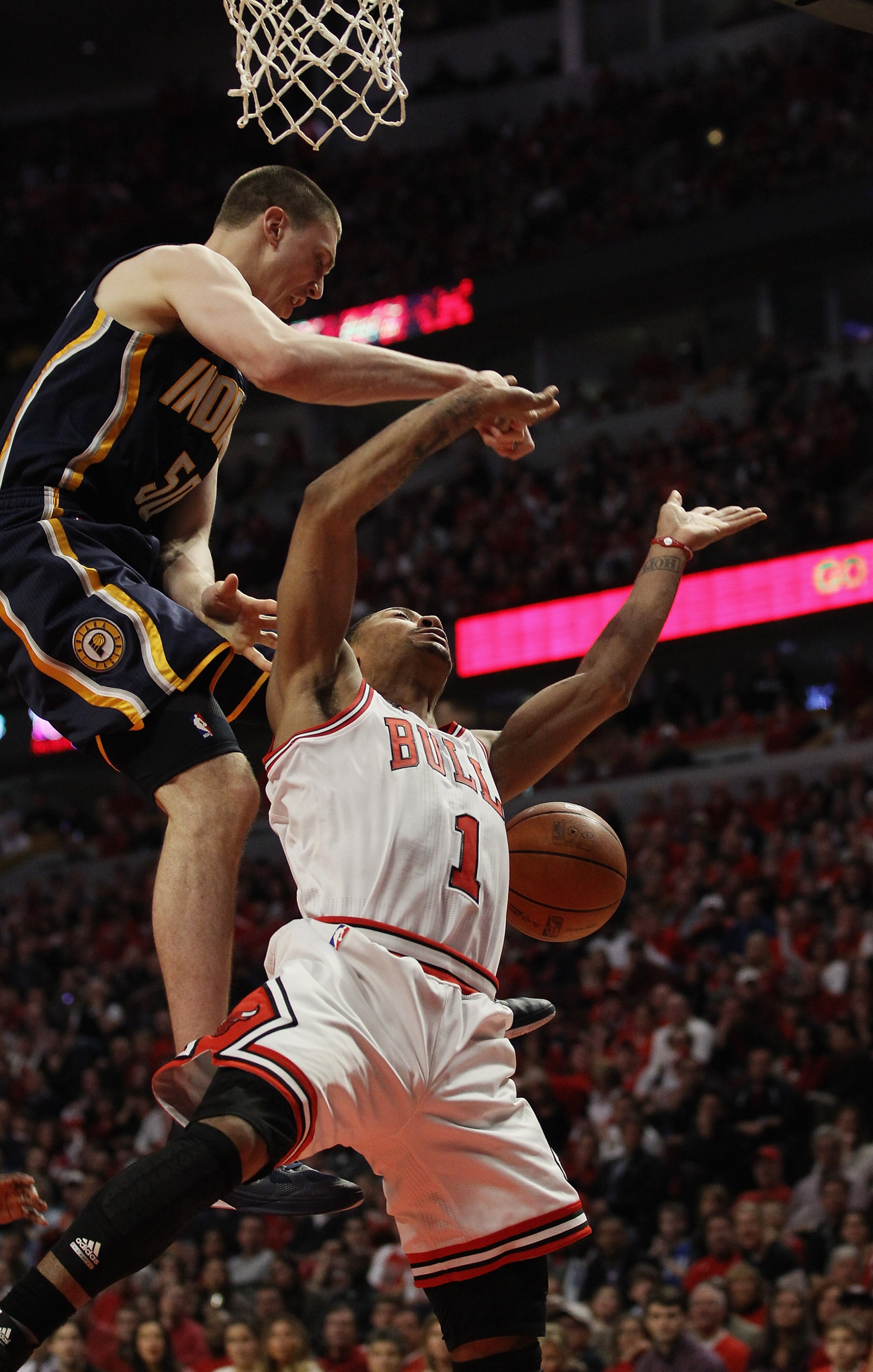 CHICAGO, IL - APRIL 16: Derrick Rose #1 of the Chicago Bulls is fouled as he moves to the basket by Tyler Hansbrough #50 of the Indiana Pacers in Game One of the Eastern Conference Quarterfinals in the 2011 NBA Playoffs at the United Center on April 16, 2 CHICAGO, IL - APRIL 16: Derrick Rose #1 of the Chicago Bulls is fouled as he moves to the basket by Tyler Hansbrough #50 of the Indiana Pacers in Game One of the Eastern Conference Quarterfinals in the 2011 NBA Playoffs at the United Center on April 16, 2