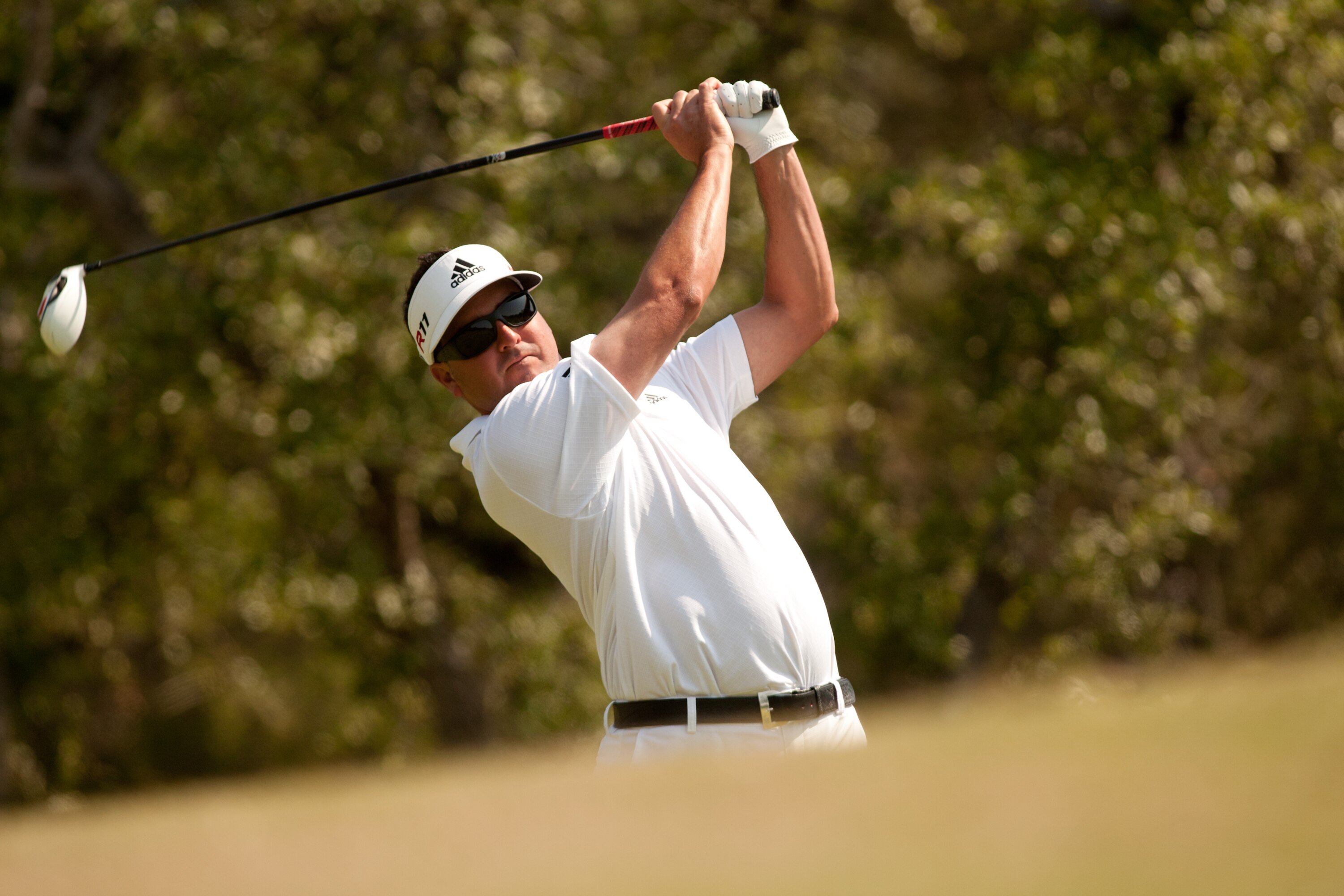 SAN ANTONIO, TX - APRIL 17: Pat Perez follows through on a tee shot during the final round of the Valero Texas Open at the AT&T Oaks Course at TPC San Antonio on April 17, 2011 in San Antonio, Texas. (Photo by Darren Carroll/Getty Images)