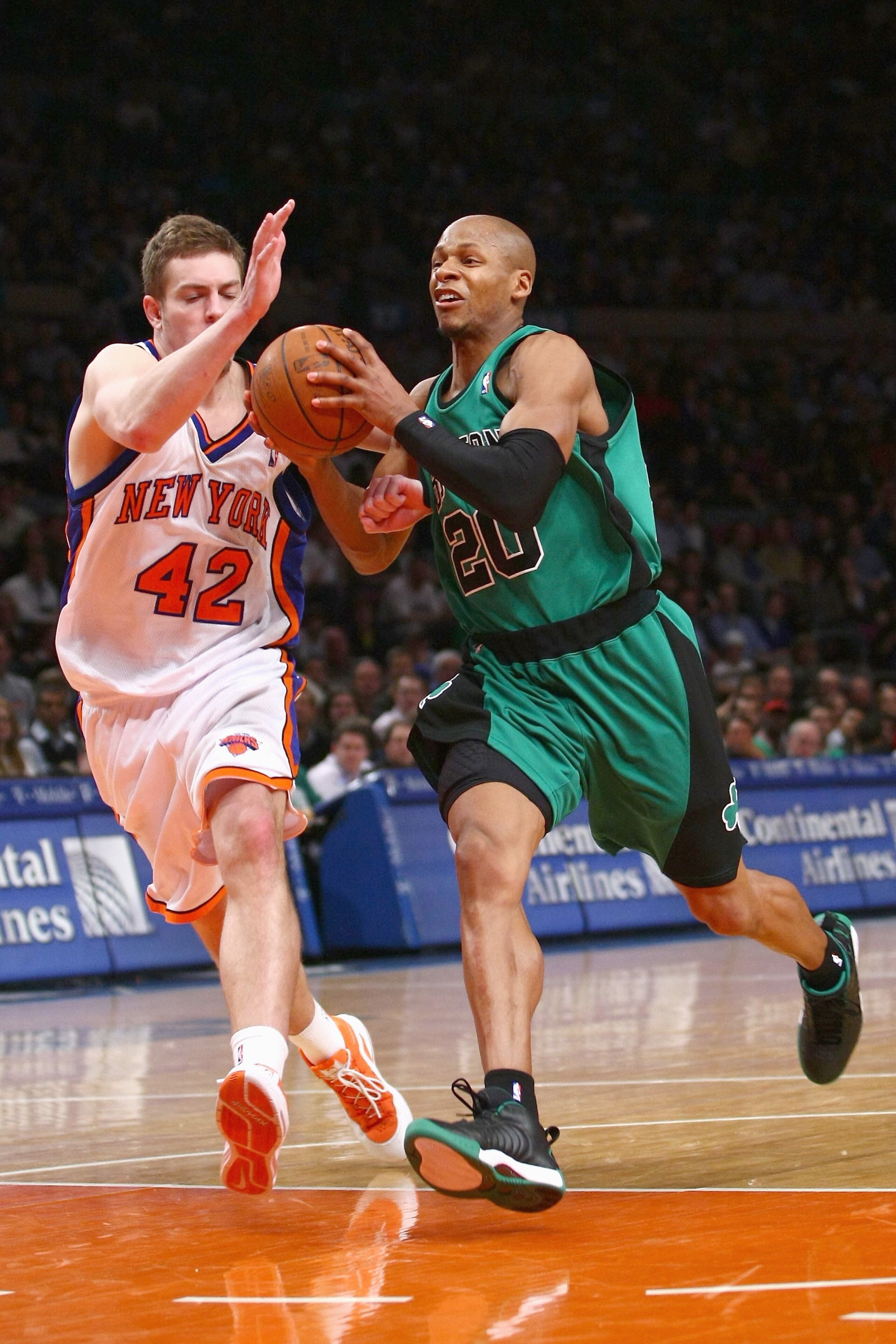 NEW YORK - FEBRUARY 06:  Ray Allen #20 of the Boston Celtics moves for the ball against David Lee #42 of the New York Knicks at Madison Square Garden on February 6, 2009 in New York City. NOTE TO USER: User expressly acknowledges and agrees that, by downl