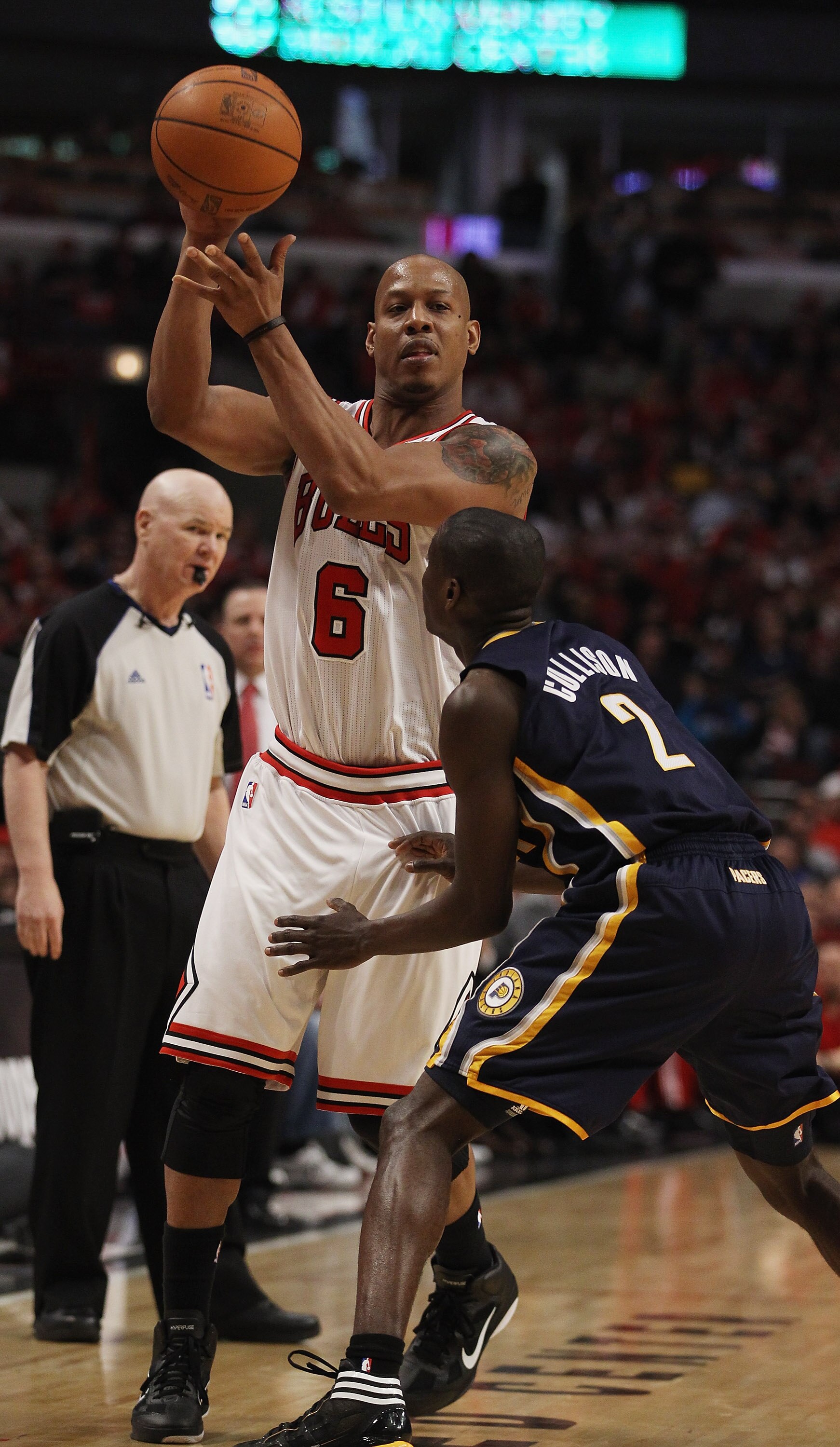 CHICAGO, IL - APRIL 16: Keith Bogans #6 of the Chicago Bulls looks to pass over Darren Collison #2 of the Indiana Pacers in Game One of the Eastern Conference Quarterfinals in the 2011 NBA Playoffs at the United Center on April 16, 2011 in Chicago, Illino