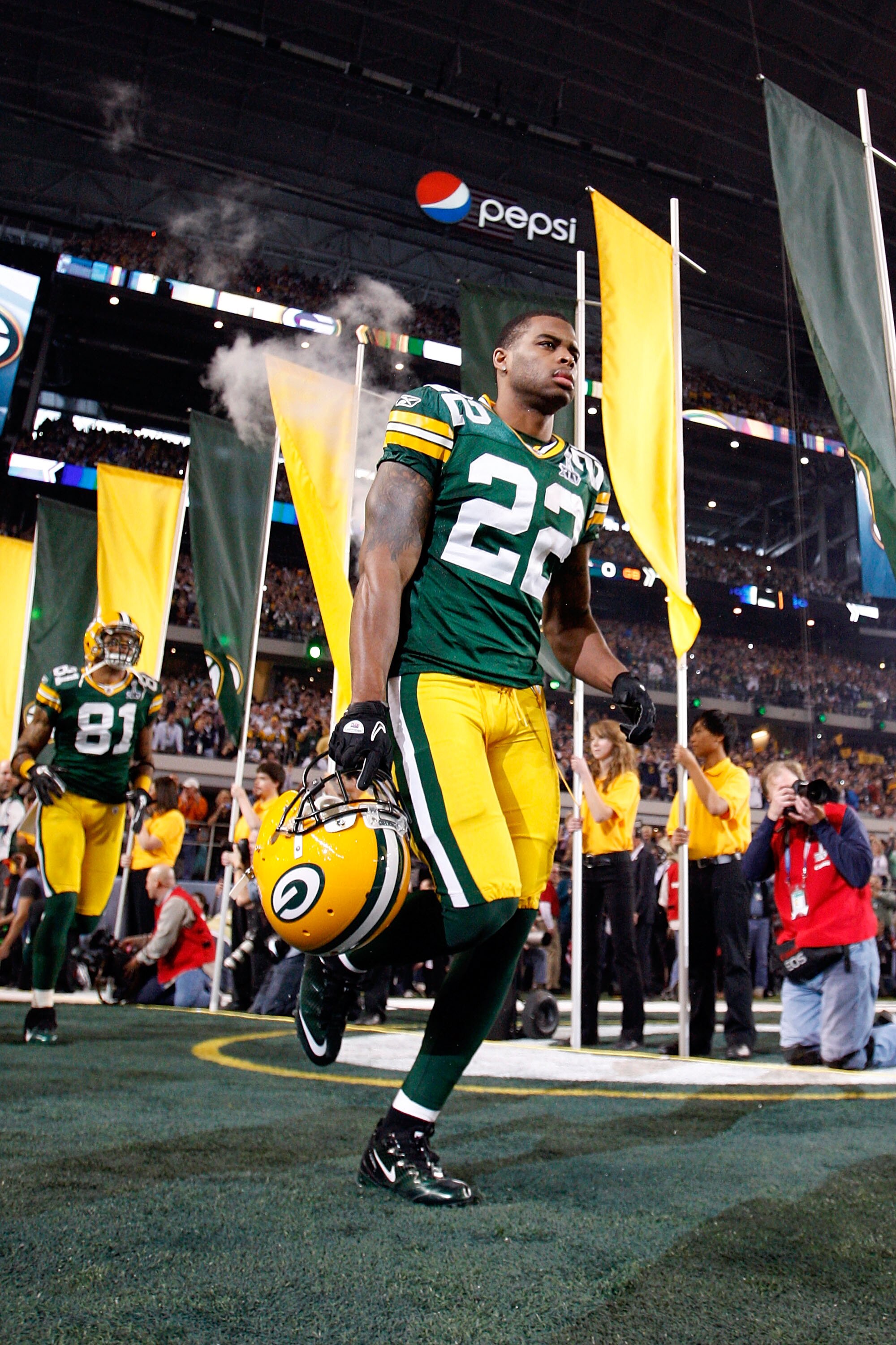 ARLINGTON, TX - FEBRUARY 06:  Pat Lee #22 of the Green Bay Packers runs onto the field during pregame introductions and festivities against the Pittsburgh Steelers during Super Bowl XLV at Cowboys Stadium on February 6, 2011 in Arlington, Texas.  (Photo b