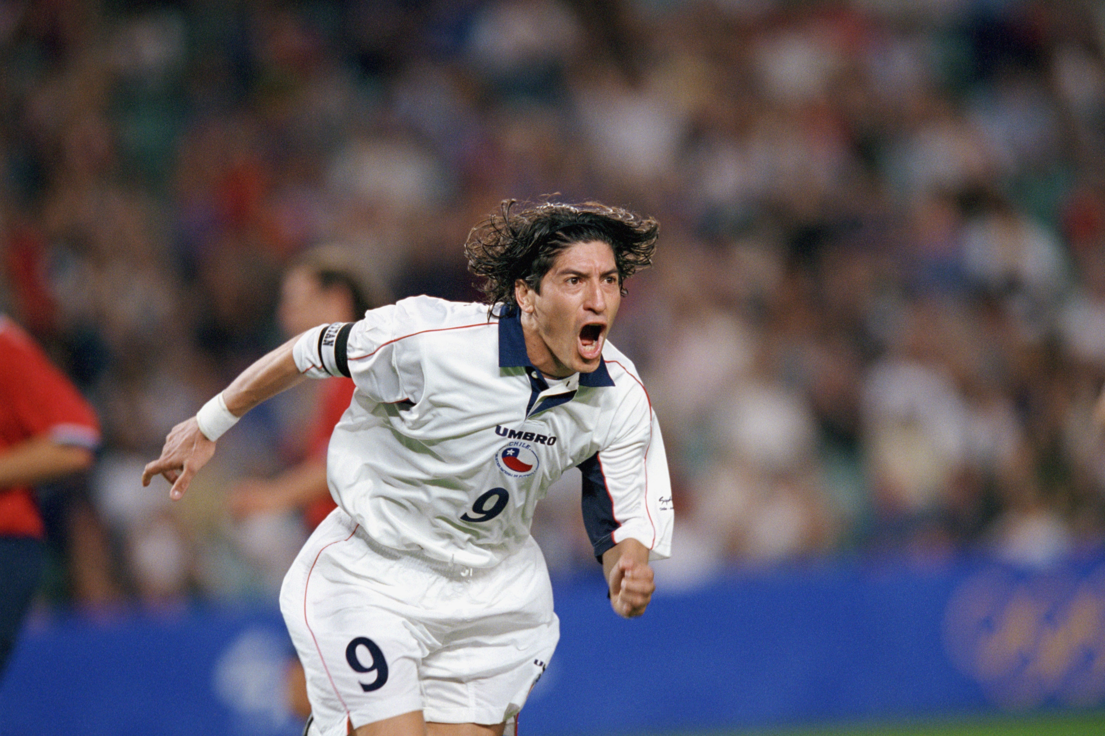 SYDNEY, AUSTRALIA - SEPTEMBER 29:  Ivan Zamorano #9 of Chile celebrates one of his two goals during the Olympic Men's Soccer Bronze Medal Game against the United States at Sydney Football Stadium in Sydney, Australia on September 29, 2000.  Chile won 2-0.