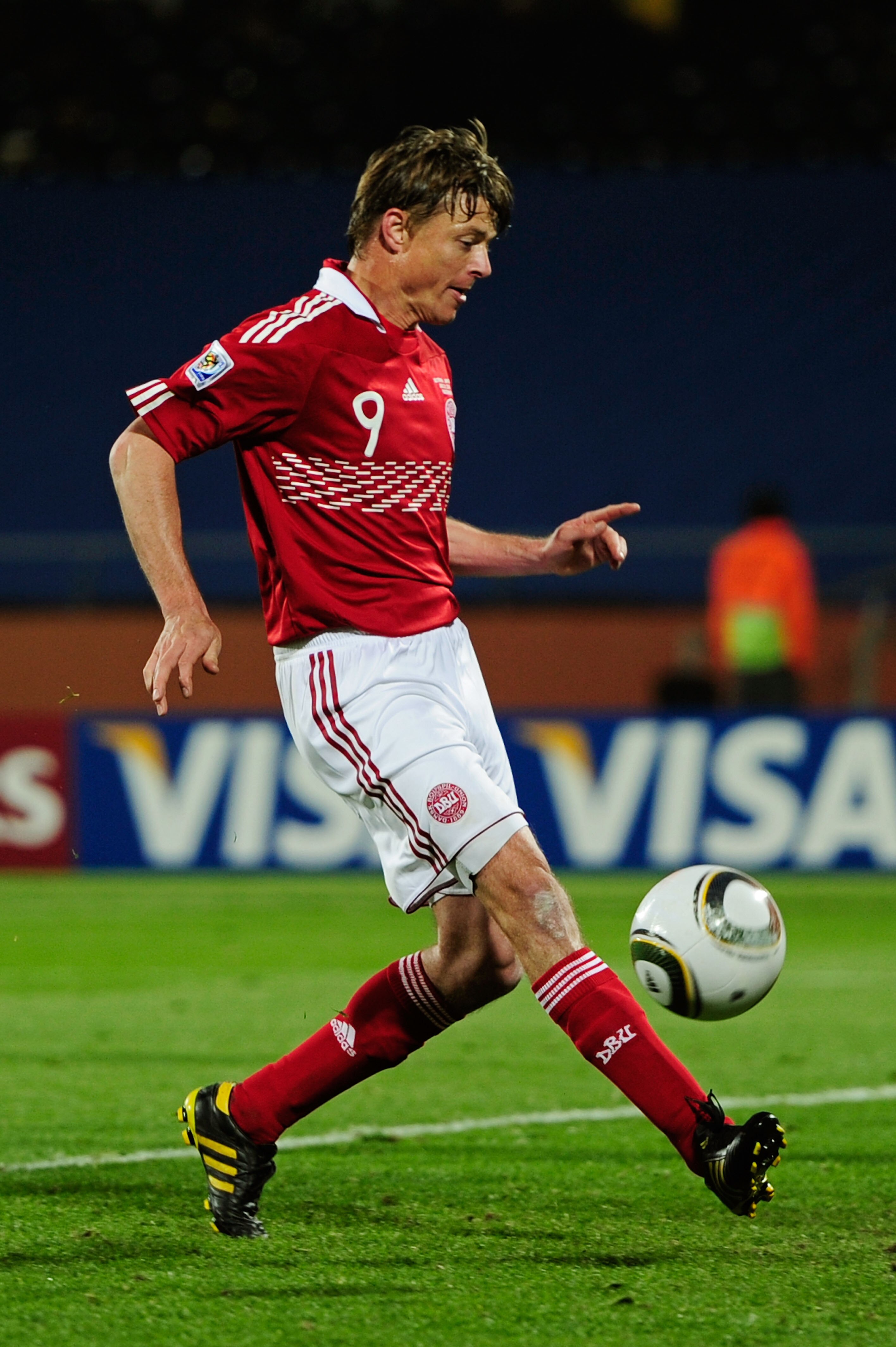 RUSTENBURG, SOUTH AFRICA - JUNE 24:  Jon Dahl Tomasson of Denmark scores the rebound from a penalty saved by Eiji Kawashima of Japan during the 2010 FIFA World Cup South Africa Group E match between Denmark and Japan at the Royal Bafokeng Stadium on June