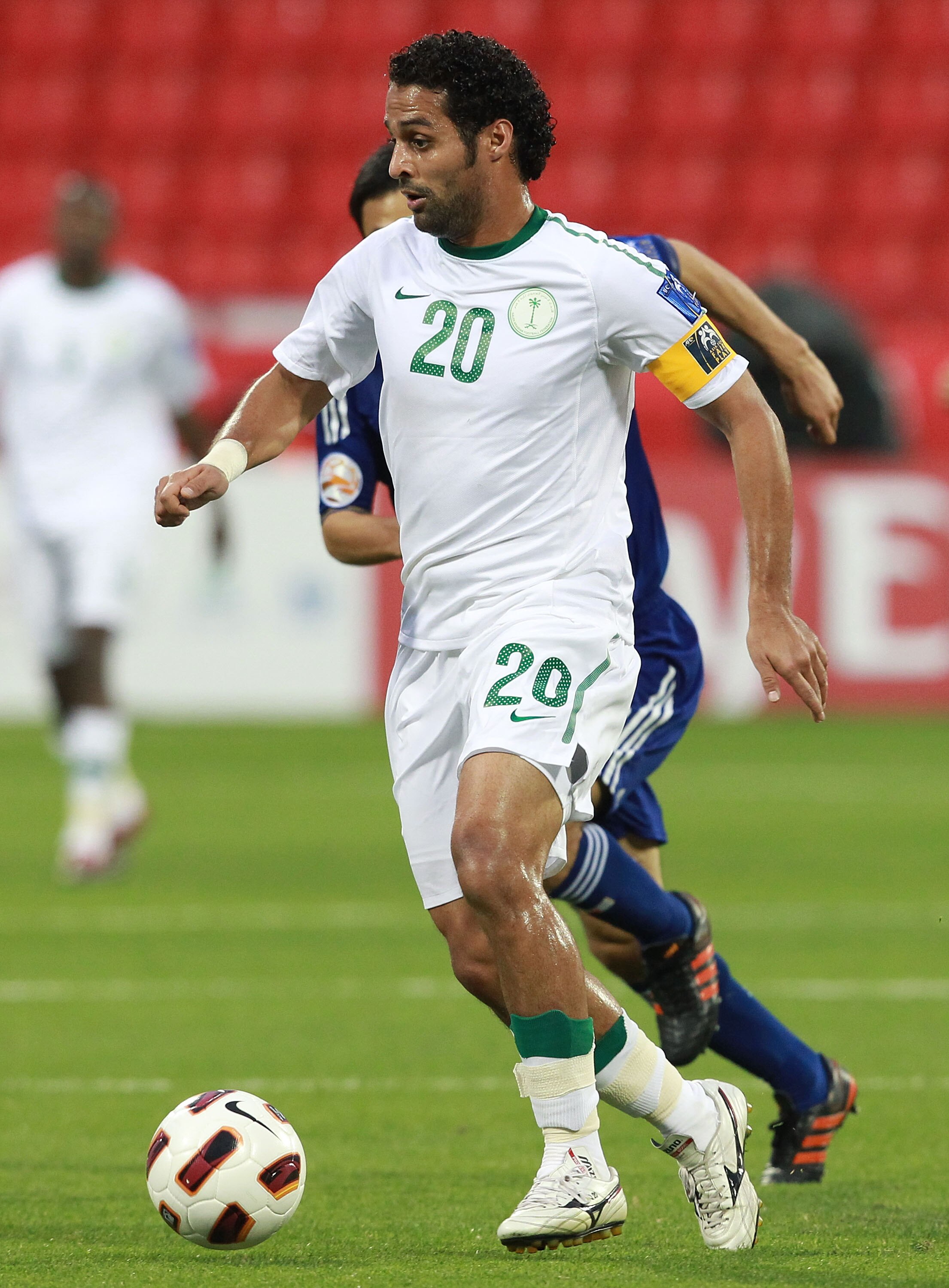 DOHA, QATAR - JANUARY 17: Yasser Al Qahtani of Saudi Arabia runs with the ball during the AFC Asian Cup Group B match between Saudi Arabia and Japan at Al-Rayyan Stadium on January 17, 2011 in Doha, Qatar.  (Photo by Robert Cianflone/Getty Images)
