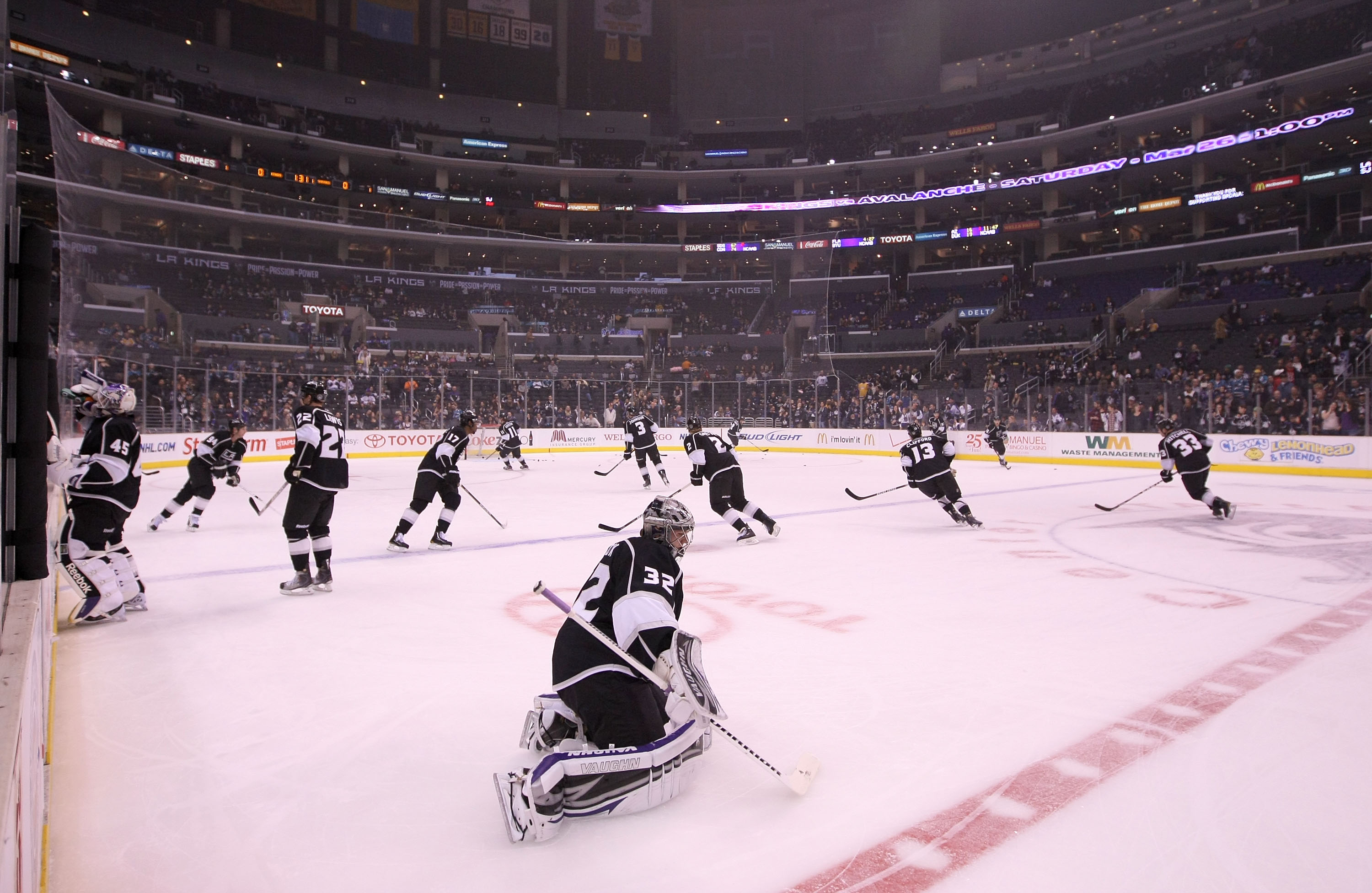 LOS ANGELES, CA - MARCH 24:  Goaltender Jonathan Quick #32 of the Los Angeles Kings stretches at center ice during warm-up prior to the NHL game against the San Jose Sharks at Staples Center on March 24, 2011 in Los Angeles, California. The Kings defeated