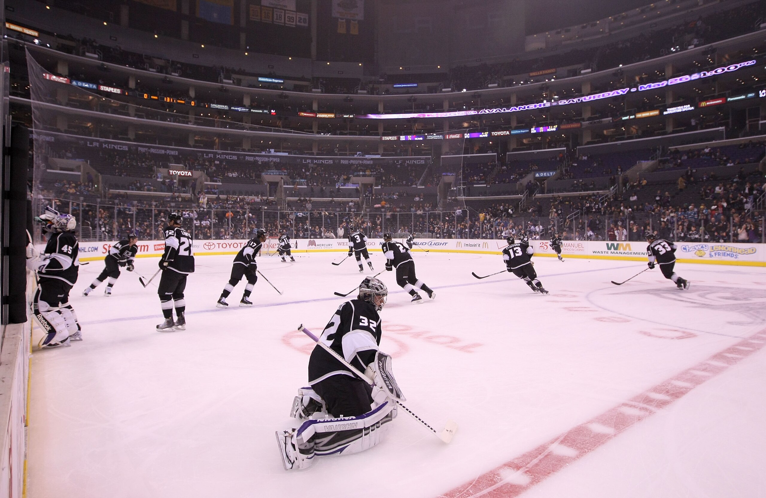 LOS ANGELES, CA - MARCH 24:  Goaltender Jonathan Quick #32 of the Los Angeles Kings stretches at center ice during warm-up prior to the NHL game against the San Jose Sharks at Staples Center on March 24, 2011 in Los Angeles, California. The Kings defeated
