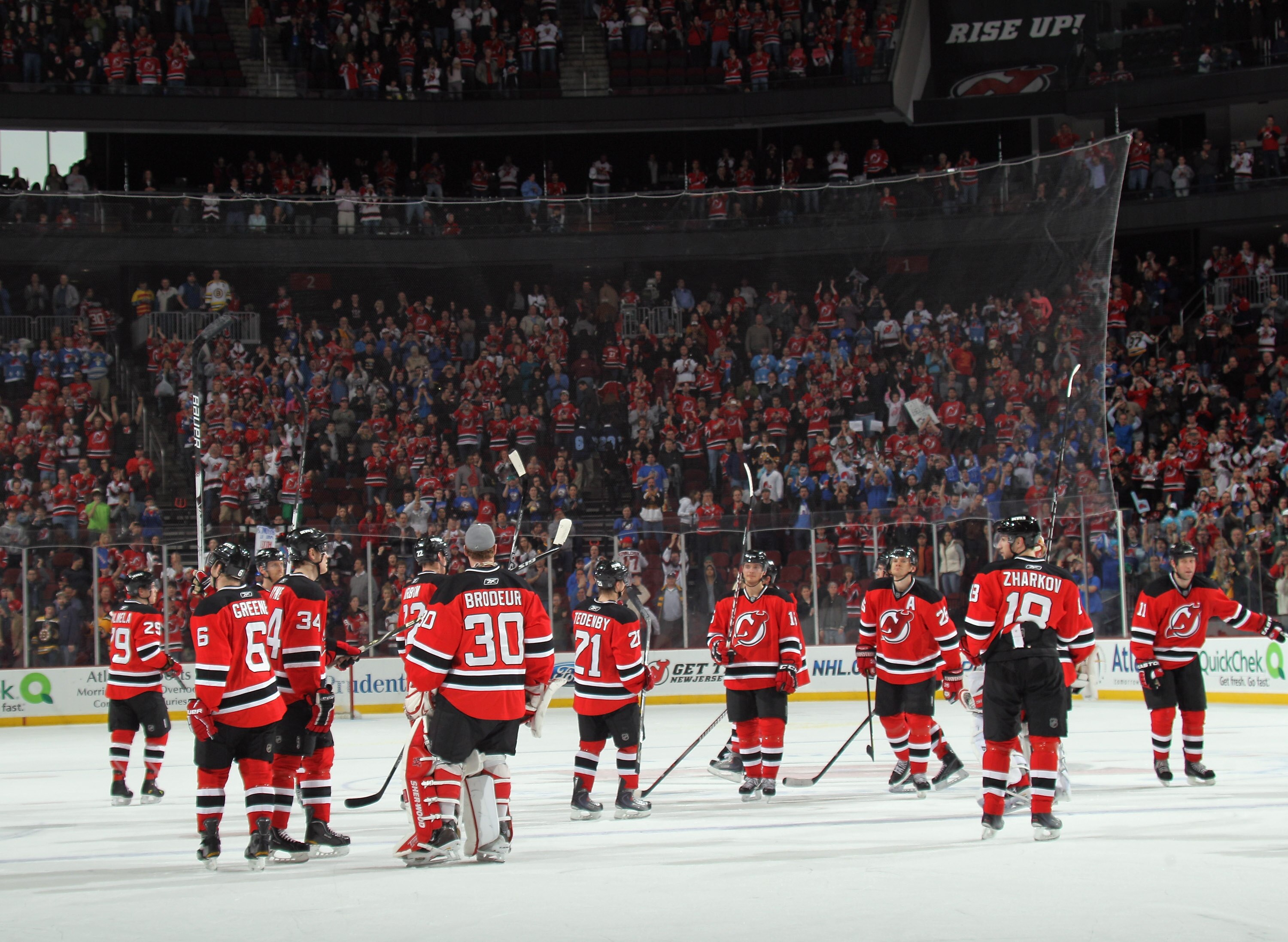 NEWARK, NJ - APRIL 10: The New Jersey Devils salute their fans following their last game of the season against the Boston Bruins at the Prudential Center on April 10, 2011 in Newark, New Jersey.  (Photo by Bruce Bennett/Getty Images)