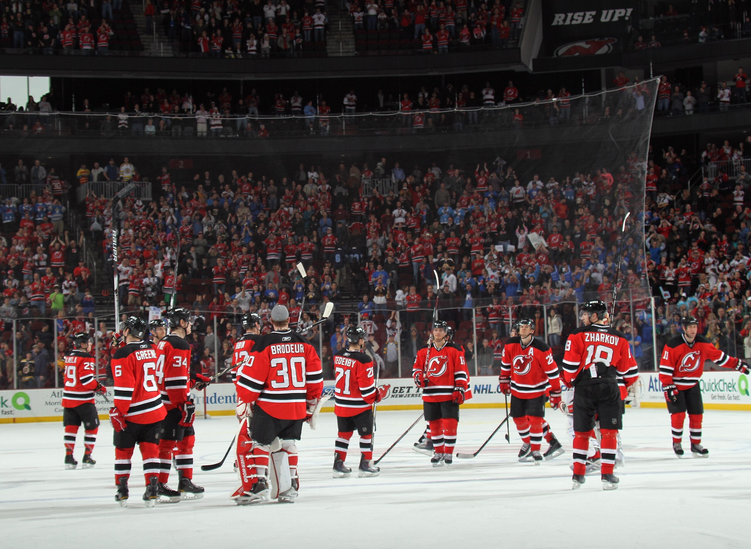 NEWARK, NJ - APRIL 10: The New Jersey Devils salute their fans following their last game of the season against the Boston Bruins at the Prudential Center on April 10, 2011 in Newark, New Jersey.  (Photo by Bruce Bennett/Getty Images)