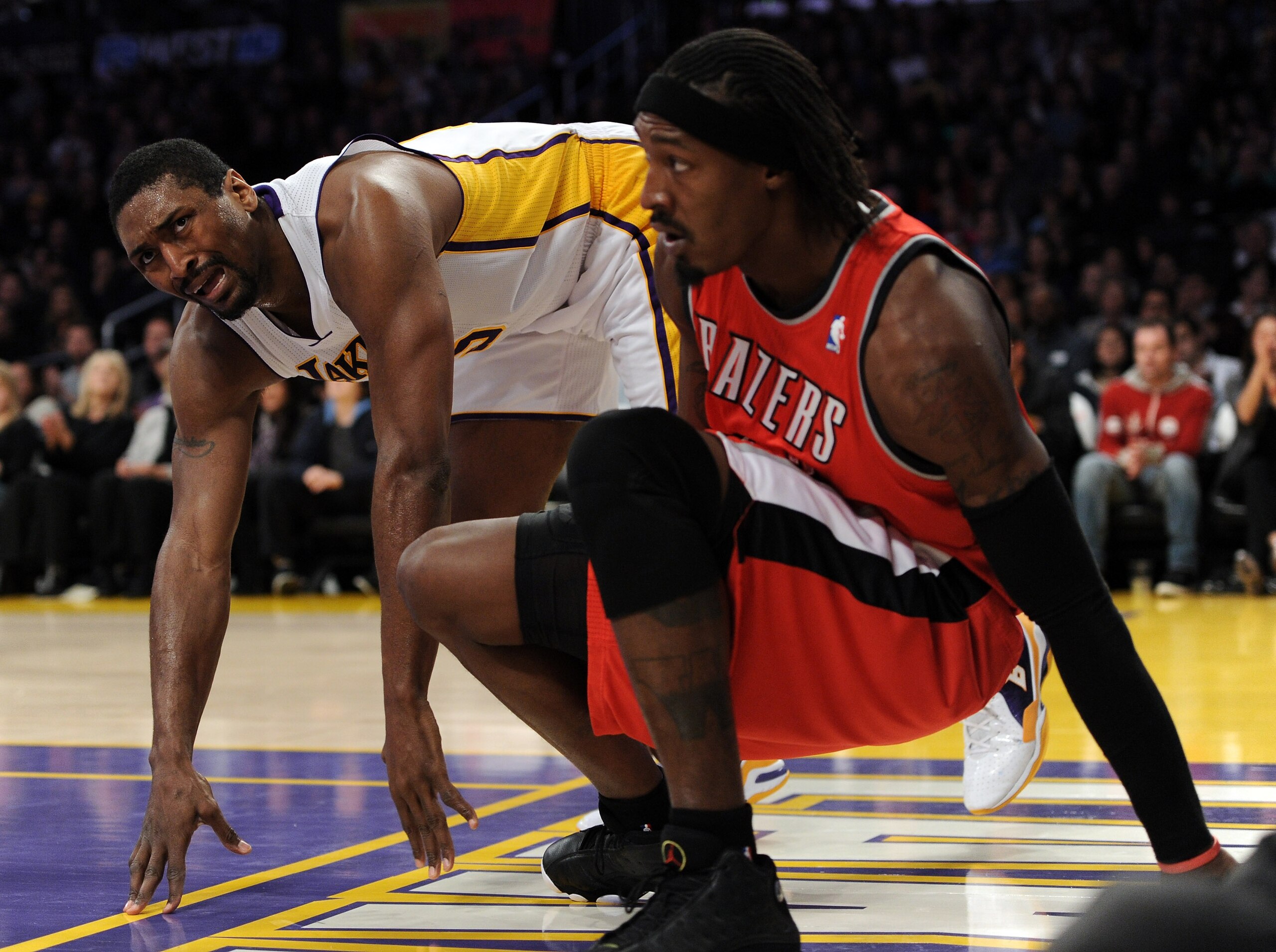 LOS ANGELES, CA - MARCH 20:  Ron Artest #15 of the Los Angeles Lakers reacts for a foul call in front of Gerlad Wallace #3 of the Portland Trail Blazers at the Staples Center on March 20, 2011 in Los Angeles, California.  NOTE TO USER: User expressly ackn