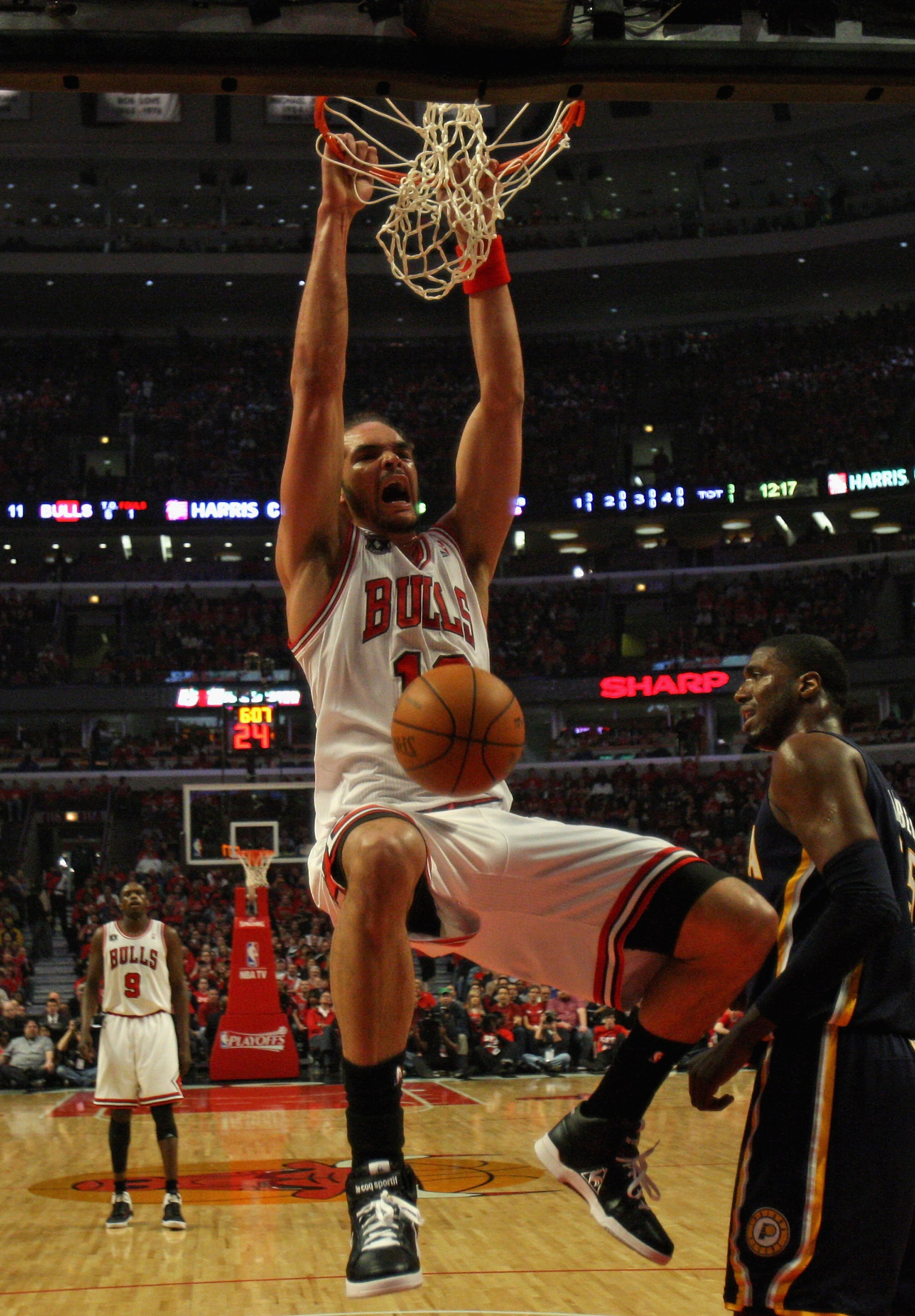 CHICAGO, IL - APRIL 16: Joakim Noah #13 of the Chicago Bulls dunks the ball against the Indiana Pacers in Game One of the Eastern Conference Quarterfinals in the 2011 NBA Playoffs at the United Center on April 16, 2011 in Chicago, Illinois. The Bulls defe