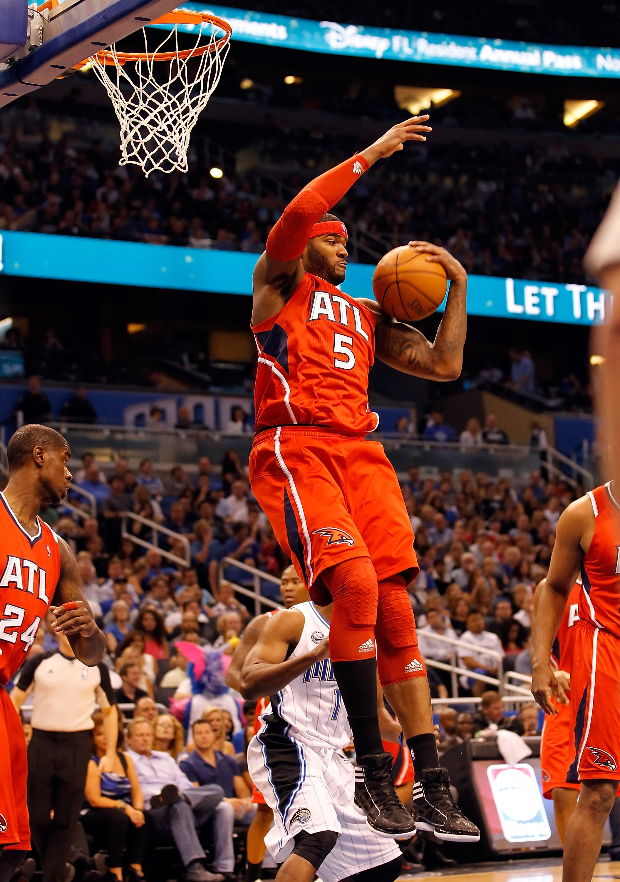 ORLANDO, FL - APRIL 16:  Josh Smith #5 of the Atlanta Hawks rebounds against the Orlando Magic during Game One of the Eastern Conference Quarterfinals of the 2011 NBA Playoffs on April 16, 2011 at the Amway Arena in Orlando, Florida.  NOTE TO USER: User e