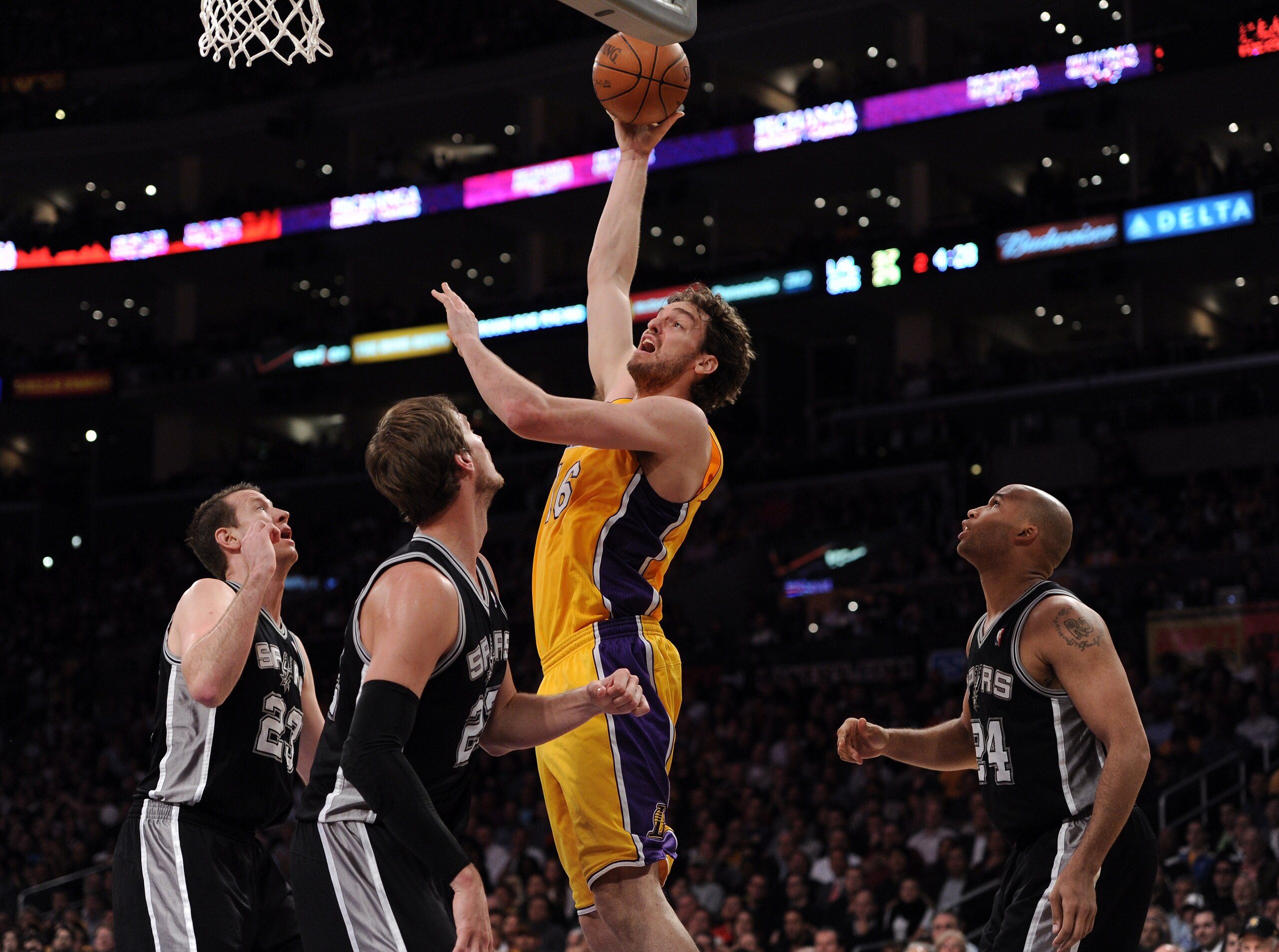 LOS ANGELES, CA - APRIL 12:  Pau Gasol #16 of the Los Angeles Lakers shoots a jump hooks in front of Steve Novak #23, Tiago Splitter #22 and Richard Jefferson #24 of the San Antonio Spurs at Staples Center on April 12, 2011 in Los Angeles, California.  NO