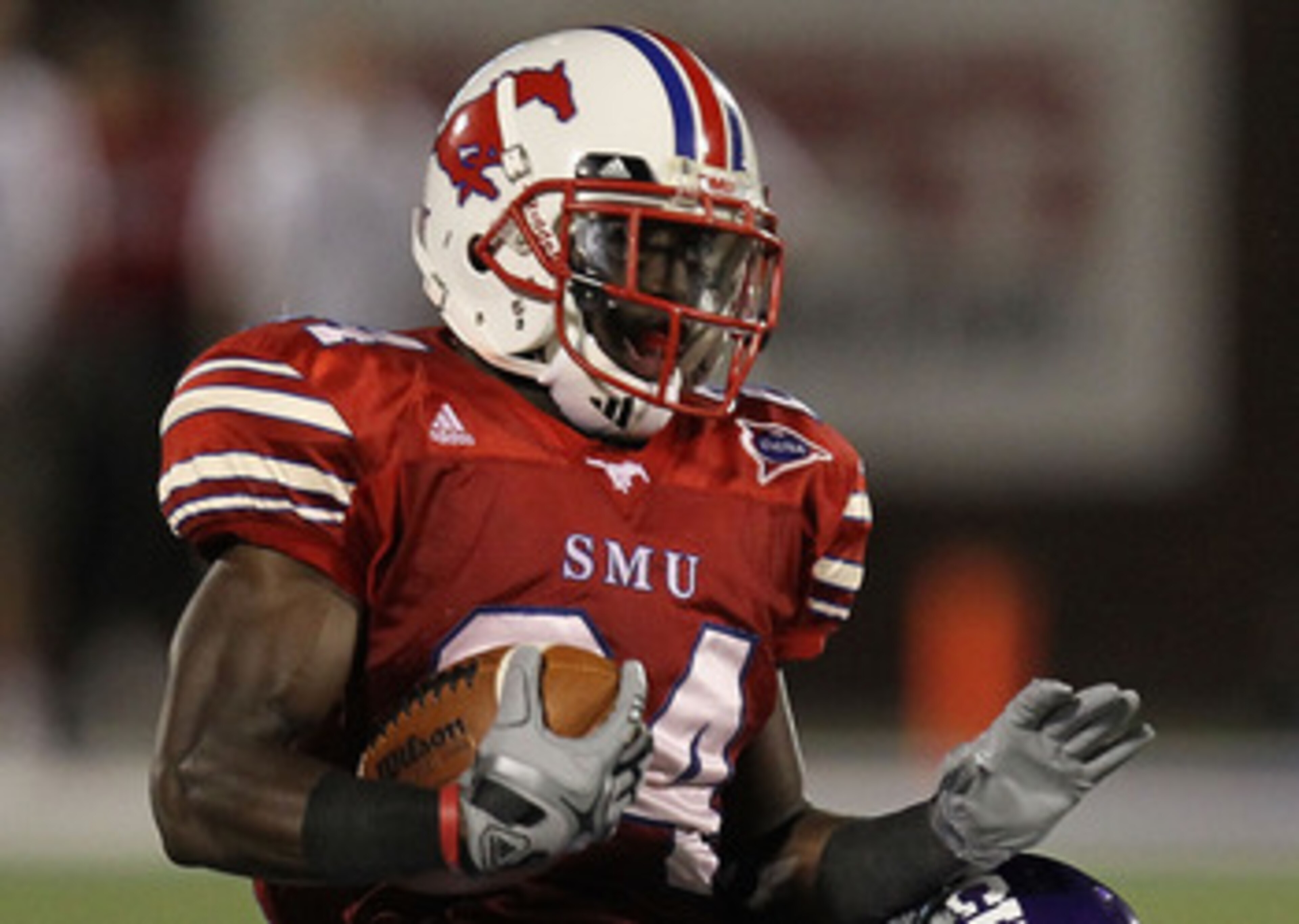 DALLAS - SEPTEMBER 24:   Wide receiver Aldrick Robinson #24 of the SMU Mustangs is tackled by Greg McCoy #7 of the TCU Horned Frogs at Gerald J. Ford Stadium on September 24, 2010 in Dallas, Texas.  (Photo by Ronald Martinez/Getty Images)