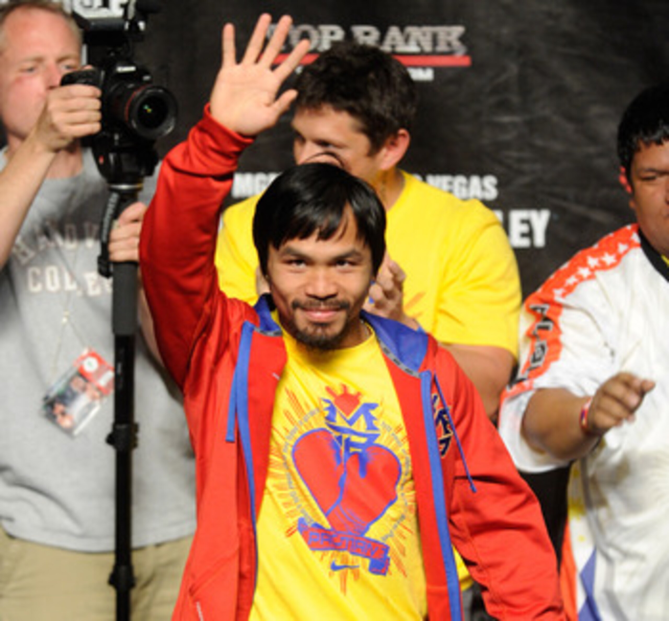 LAS VEGAS, NV - MAY 06:  Boxer Manny Pacquiao of the Philippines greets the crowd before he steps on the scale at 145 pounds before his WBO welterweight title fight against Shane Mosley at MGM Grand Garden Arena on May 6, 2011 in Las Vegas, Nevada. Pacqui