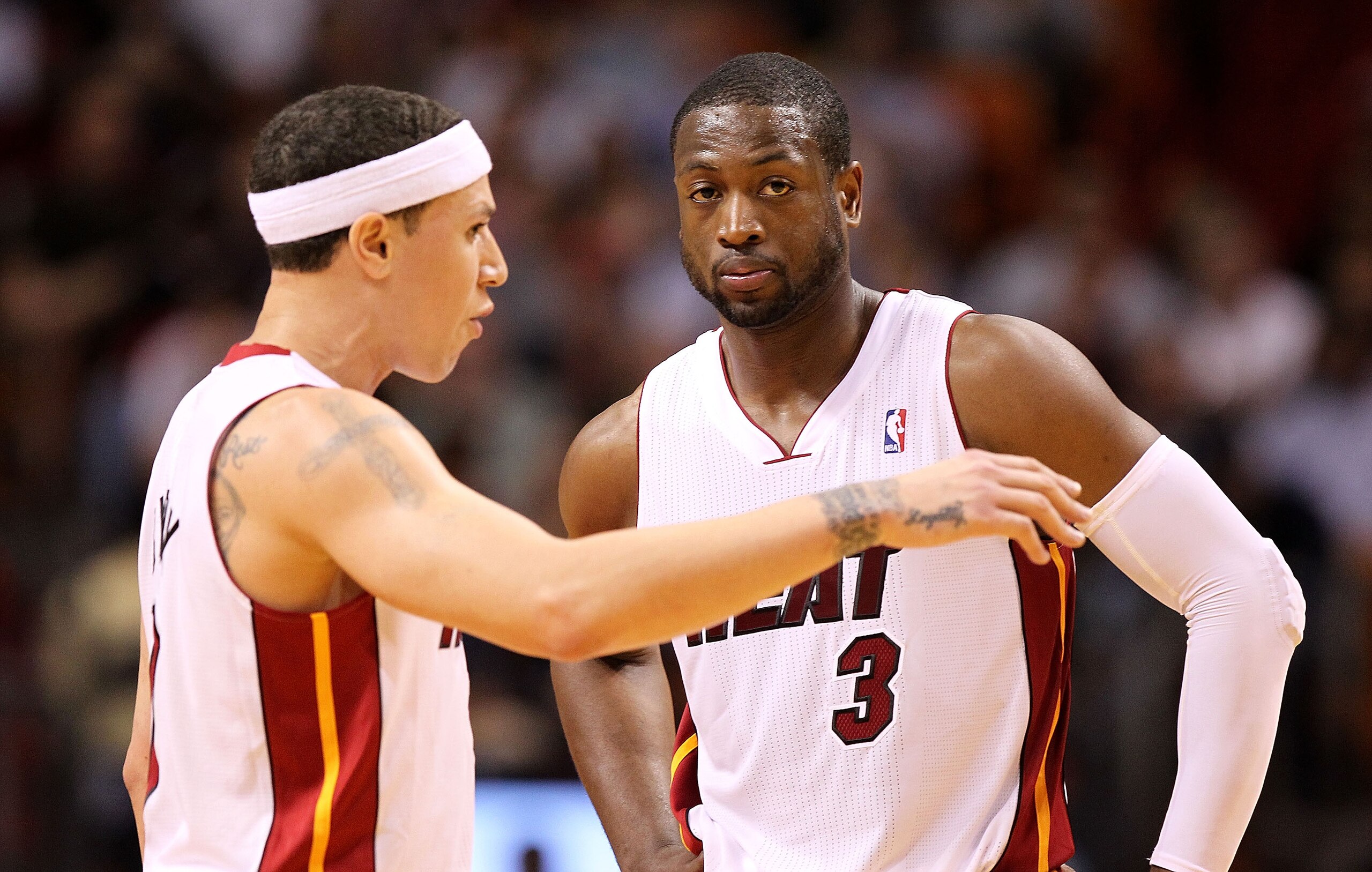 MIAMI, FL - MARCH 08: Mike Bibby #0 and Dwyane Wade #3 of the Miami Heat talk during a game against the Portland Trail Blazers at American Airlines Arena on March 8, 2011 in Miami, Florida. NOTE TO USER: User expressly acknowledges and agrees that, by dow