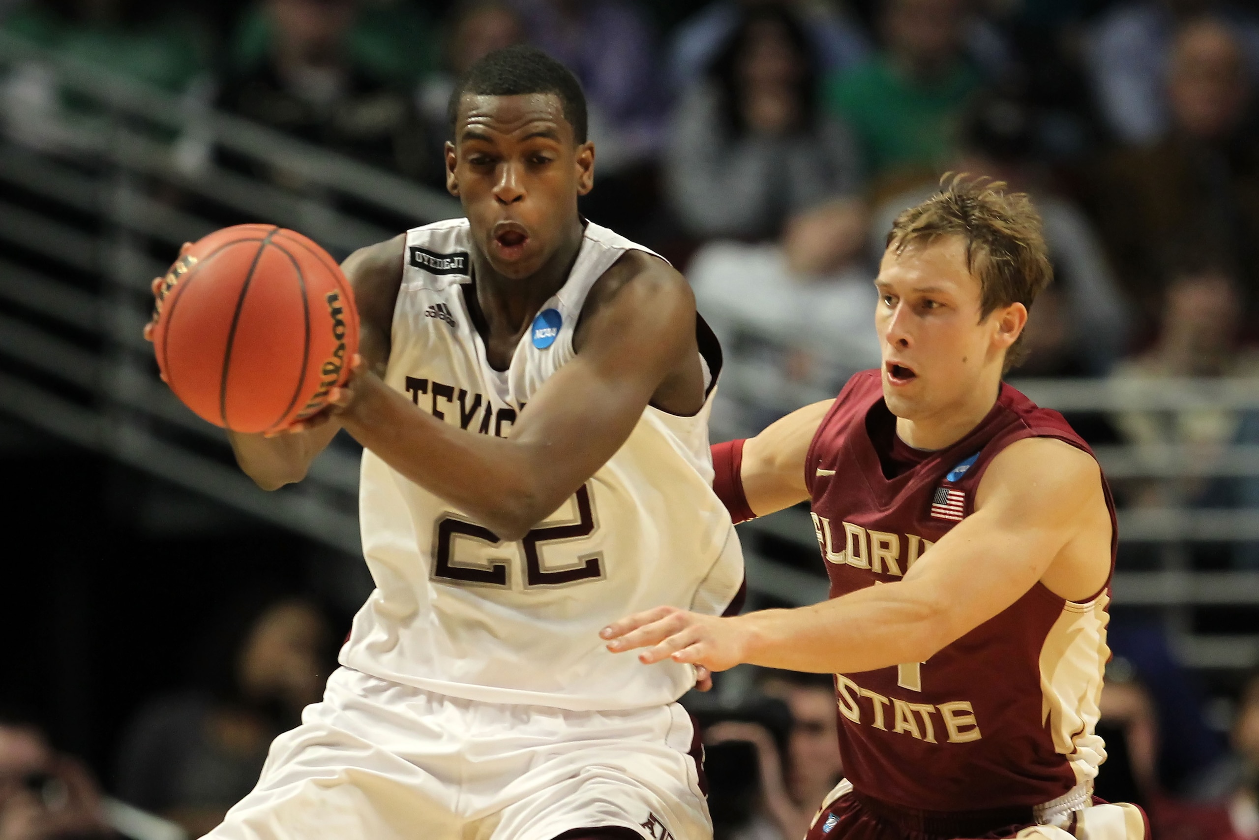 CHICAGO, IL - MARCH 18: Khris Middleton #22 of the Texas A&M Aggies controls the ball against Deividas Dulkys #4 of the Florida State Seminoles in the first half during the second round of the 2011 NCAA men's basketball tournament at the United Center on