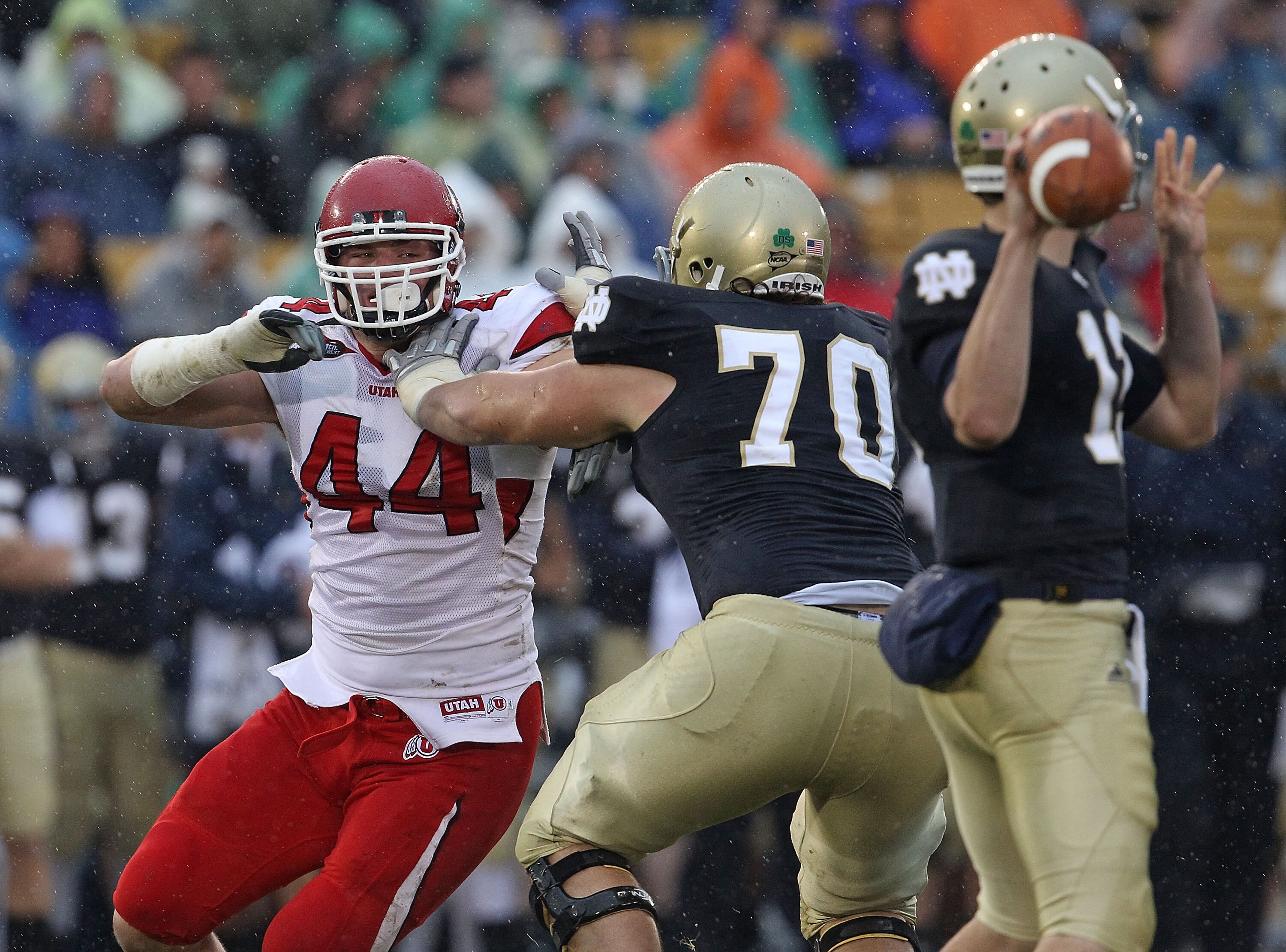 SOUTH BEND, IN - NOVEMBER 13: Dave Kruger #44 of the Utah Utes rushes against Zack Martin #70 of the Notre Dame Fighting Irish as Tommy Rees #13 passes the ball at Notre Dame Stadium on November 13, 2010 in South Bend, Indiana. Notre Dame defeated Utah 28