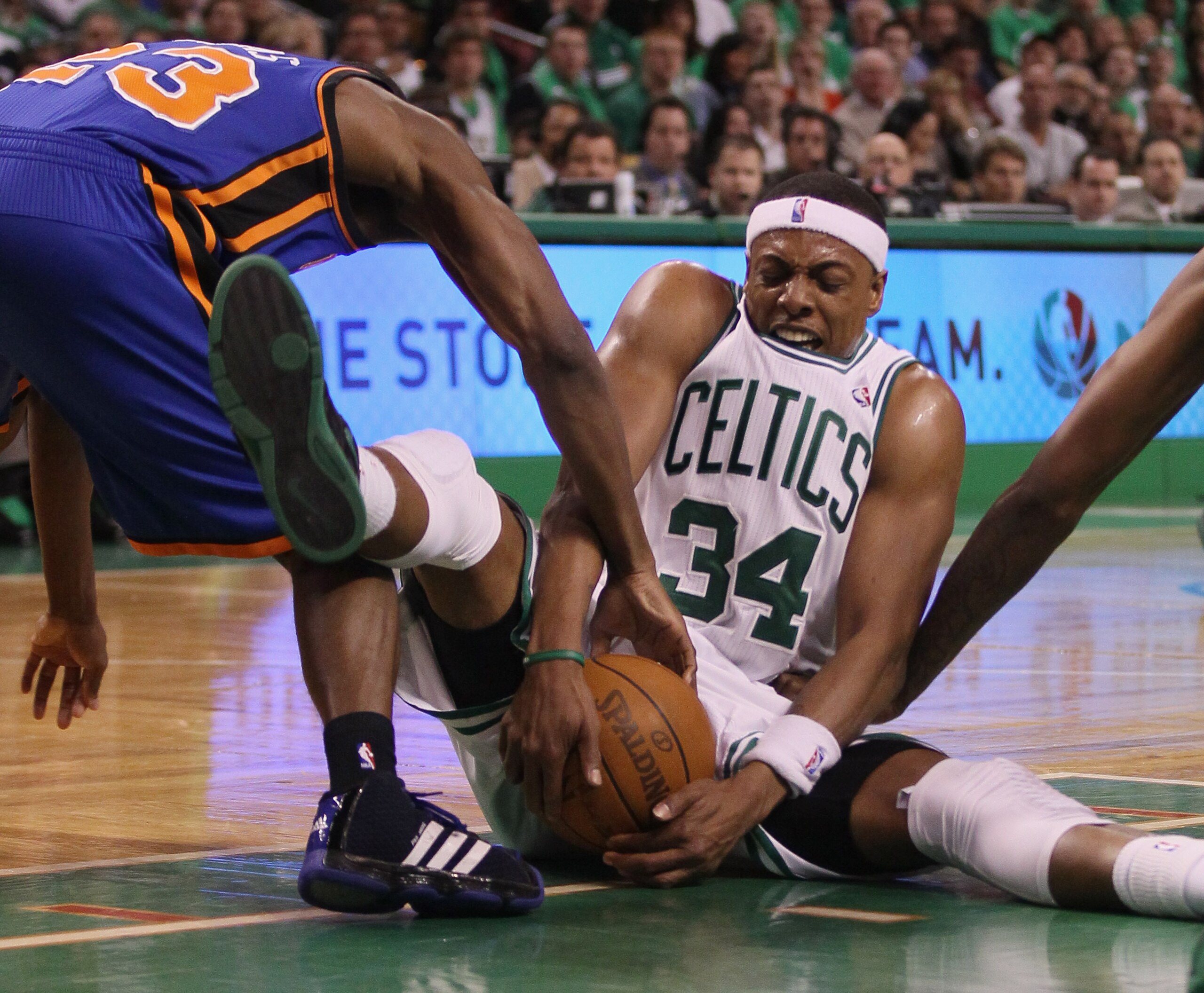 BOSTON, MA - APRIL 17:  Paul Pierce #34 of the Boston Celtics fights for the loose ball with Toney Douglas #23 of the New York Knicks in Game One of the Eastern Conference Quarterfinals in the 2011 NBA Playoffs on April 17, 2011 at the TD Garden in Boston