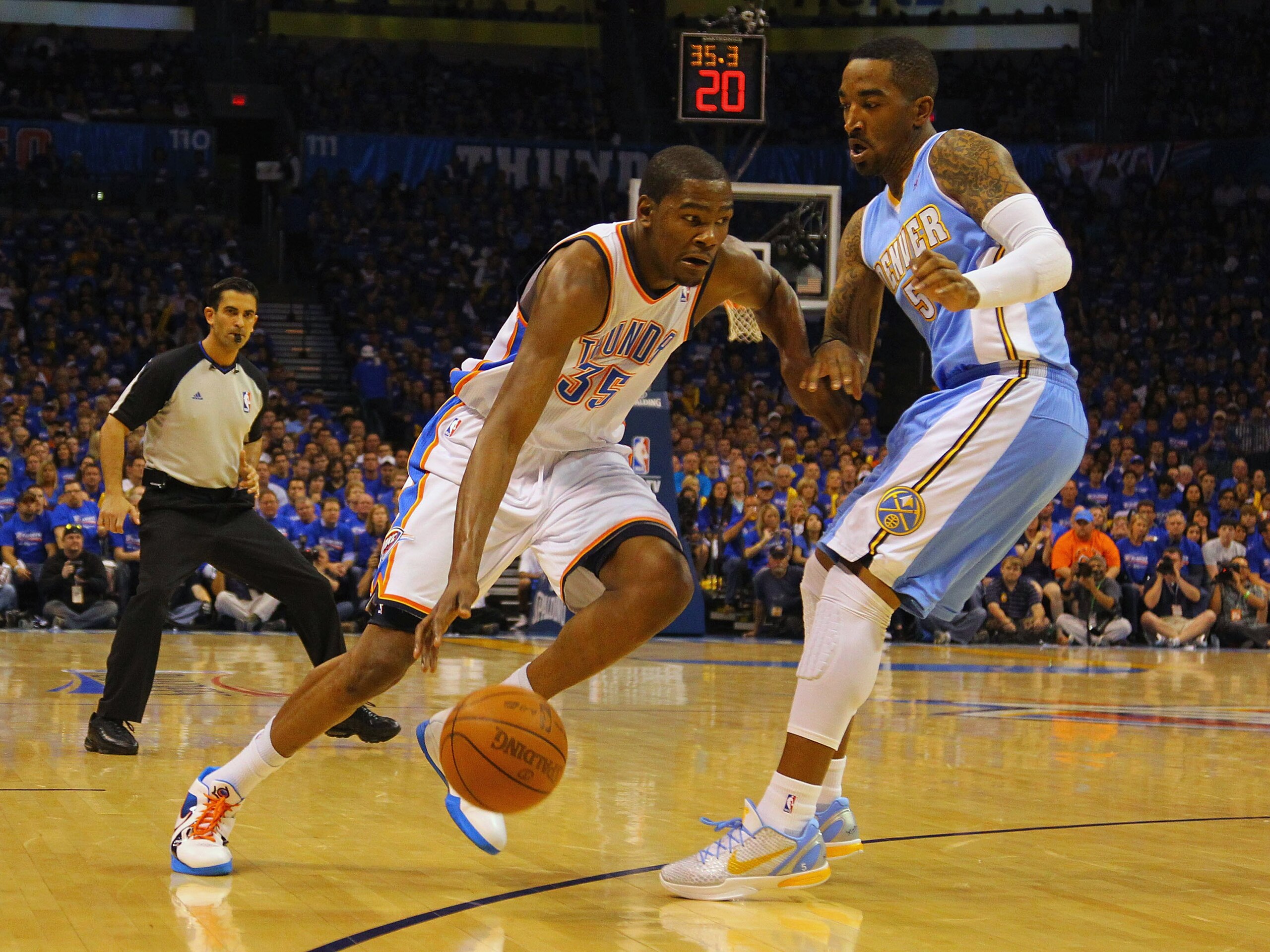 OKLAHOMA CITY, OK - APRIL 17: Kevin Durant #35 of the Oklahoma City Thunder looks to get past J.R. Smith #5 of the Denver Nuggets in Game One of the Western Conference Quarterfinals in the 2011 NBA Playoffs on April 17, 2011 at the Ford Center in Oklahoma