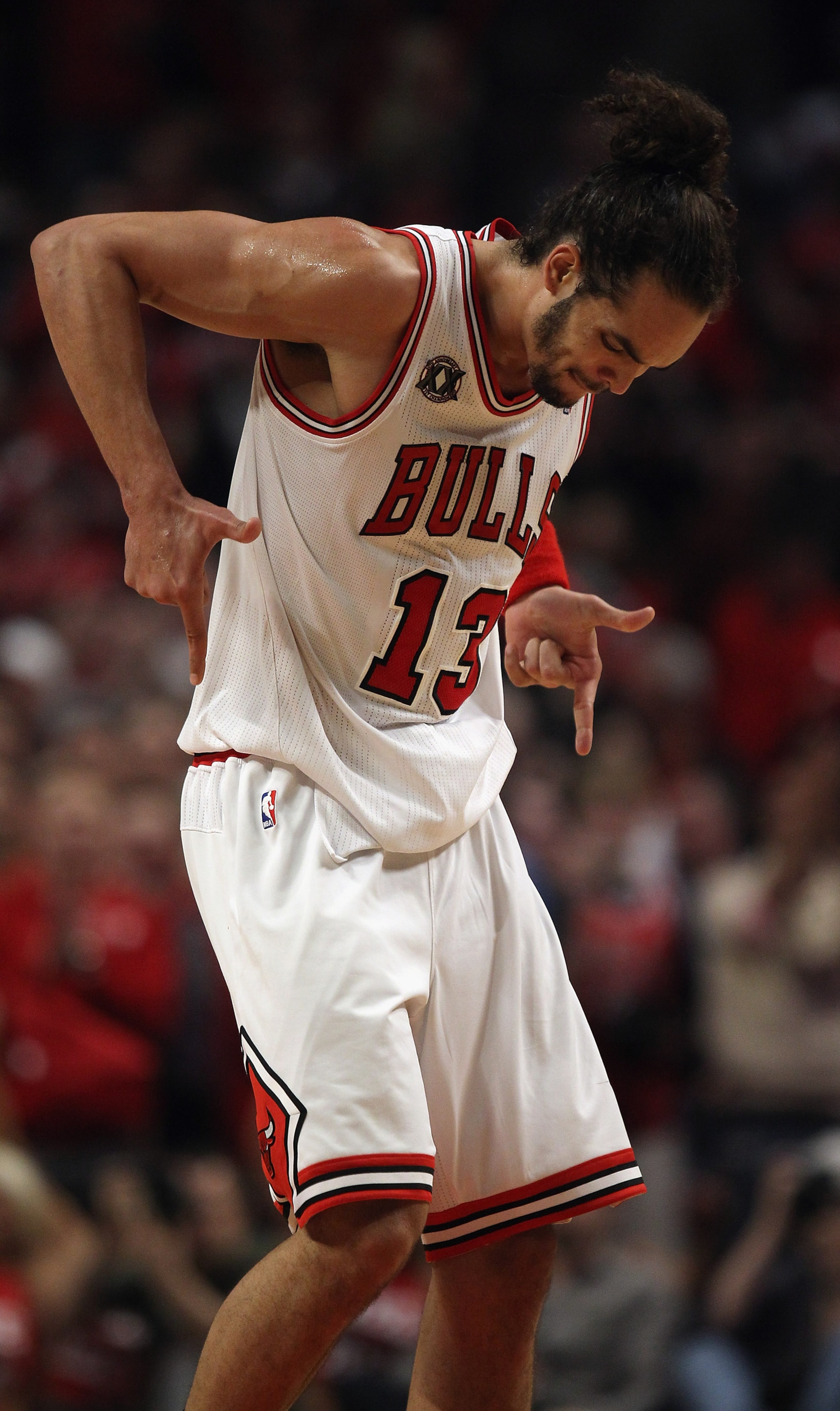 CHICAGO, IL - APRIL 16: Joakim Noah #13 of the Chicago Bulls celebrates a win over the Indiana Pacers in Game One of the Eastern Conference Quarterfinals in the 2011 NBA Playoffs at the United Center on April 16, 2011 in Chicago, Illinois. The Bulls defea