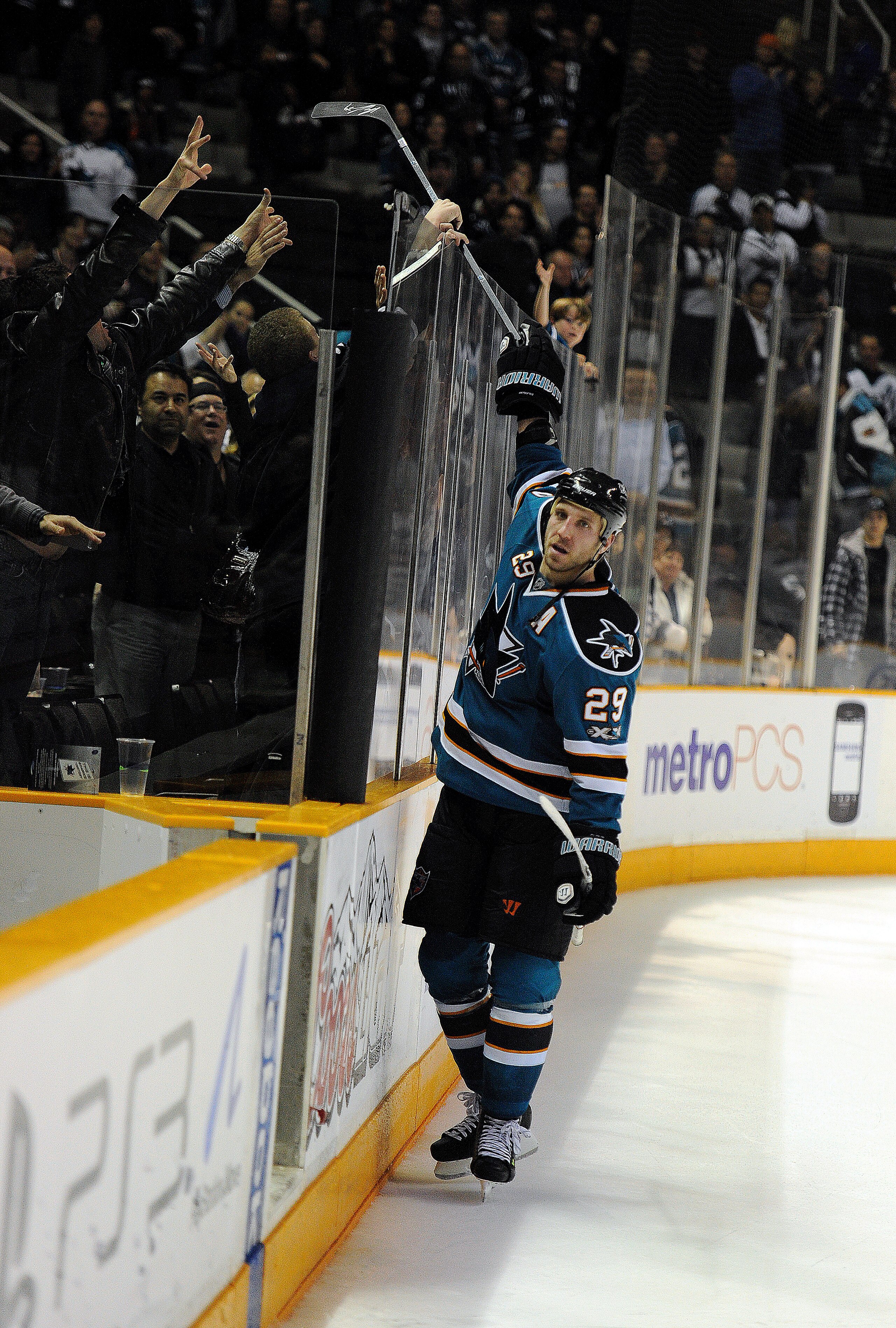 SAN JOSE, CA - MARCH 8: Ryane Clowe #29 of the San Jose Sharks the star of the game hands an autograph stick to a fan after the Sharks beat the Nashville Predators 3-2 in overtime of an NHL hockey game at the HP Pavilion on March 8, 2011 in San Jose, Cali