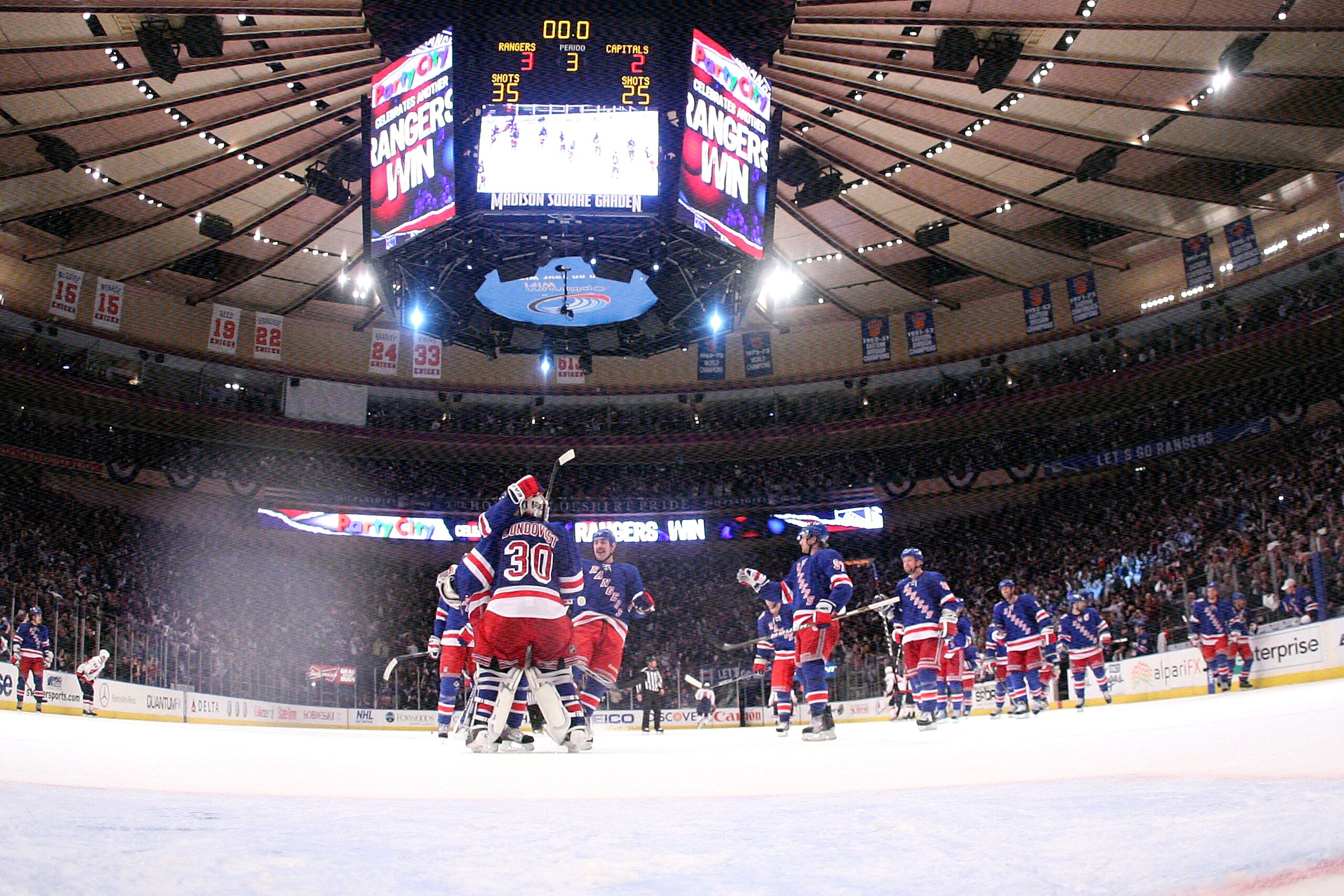 NEW YORK, NY - APRIL 17:  Goalie Henrik Lundqvist (C) #30 of the New York Rangers celebrates with his teammates after they won 3-2 against the Washington Capitals in Game Three of the Eastern Conference Quarterfinals during the 2011 NHL Stanley Cup Playof