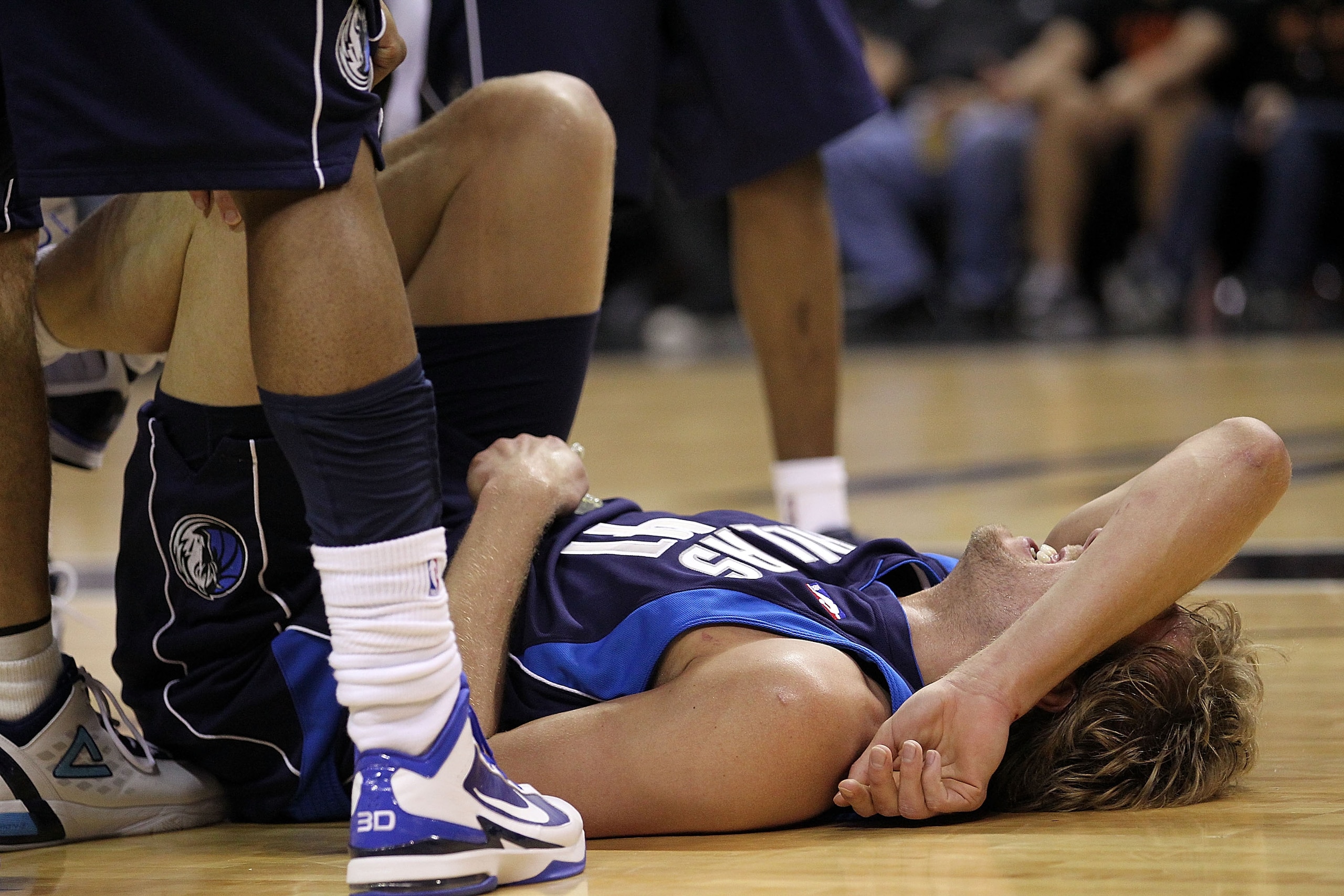 SAN ANTONIO - APRIL 29: Forward Dirk Nowitzki #41 of the Dallas Mavericks falls on the floor after being fouled during a 97-87 loss against the San Antonio Spurs in Game Six of the Western Conference Quarterfinals during the 2010 NBA Playoffs at AT&T Cen SAN ANTONIO - APRIL 29: Forward Dirk Nowitzki #41 of the Dallas Mavericks falls on the floor after being fouled during a 97-87 loss against the San Antonio Spurs in Game Six of the Western Conference Quarterfinals during the 2010 NBA Playoffs at AT&T Cen