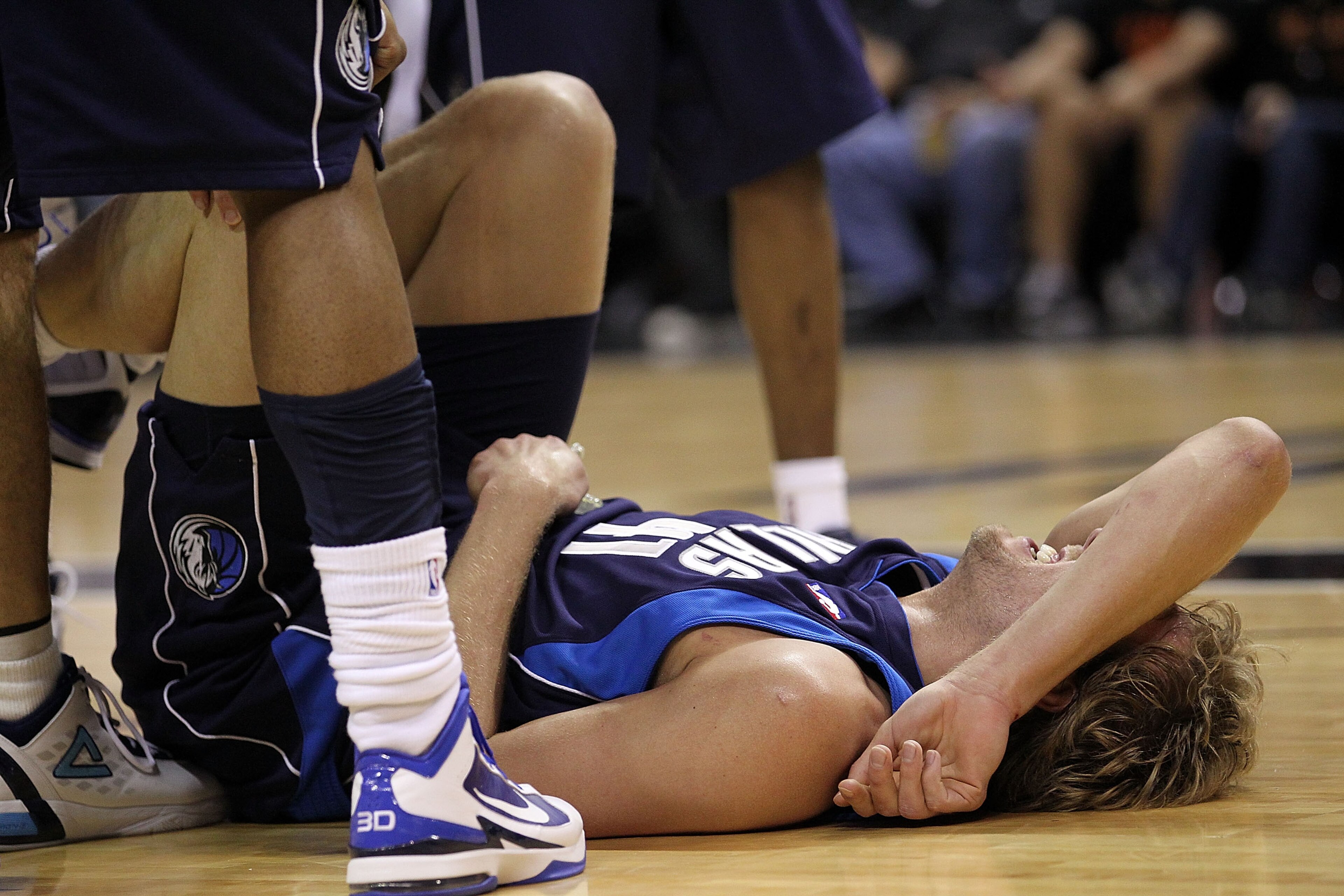 SAN ANTONIO - APRIL 29:  Forward Dirk Nowitzki #41 of the Dallas Mavericks falls on the floor after being fouled during a 97-87 loss against the San Antonio Spurs in Game Six of the Western Conference Quarterfinals during the 2010 NBA Playoffs at AT&T Cen