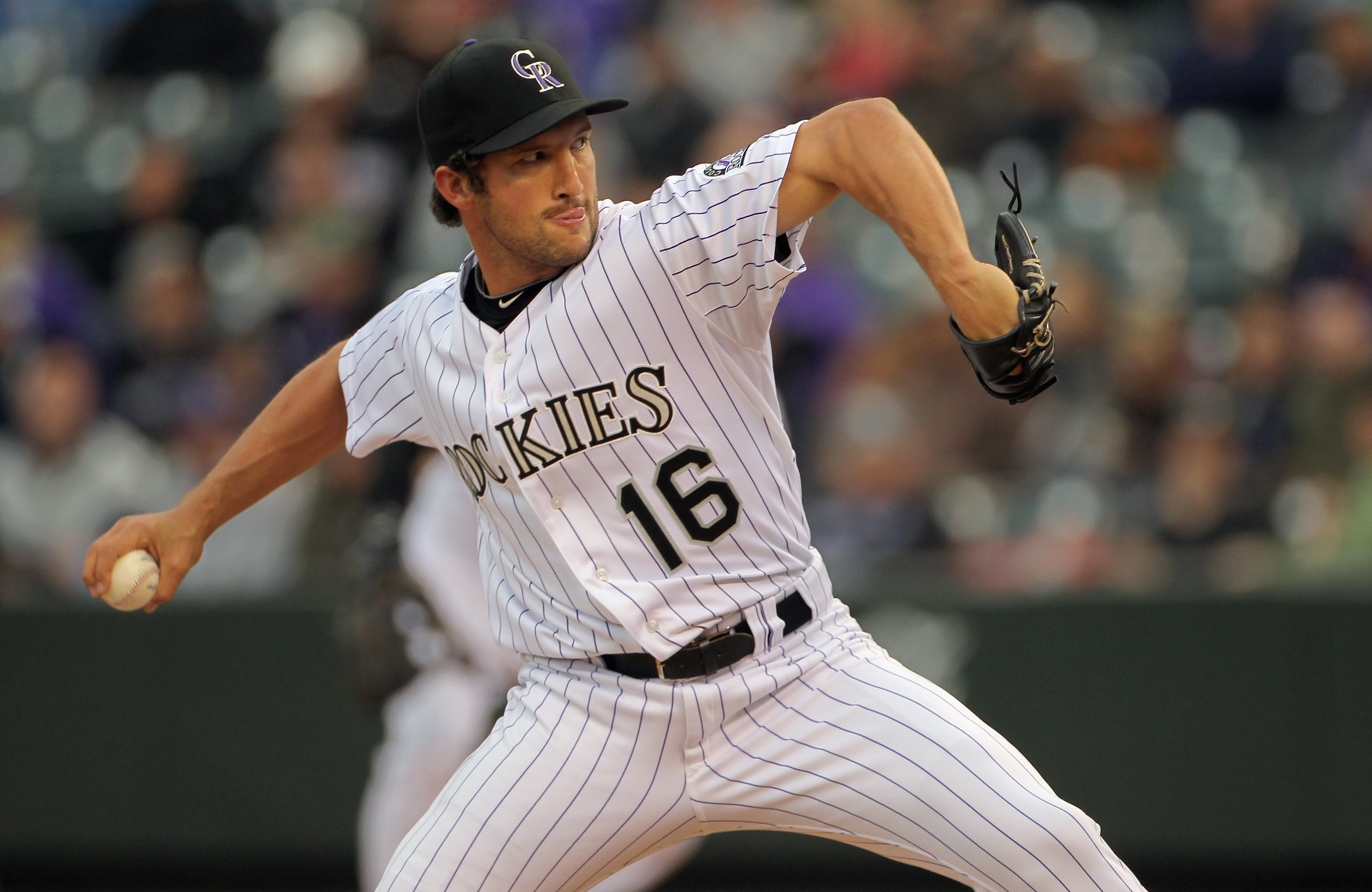 DENVER, CO - APRIL 06:  Closer Huston Street #16 of the Colorado Rockies delivers against the Los Angeles Dodgers in the ninth inning at Coors Field on April 6, 2011 in Denver, Colorado. Street earned his third save of the season as the Rockies defeated t