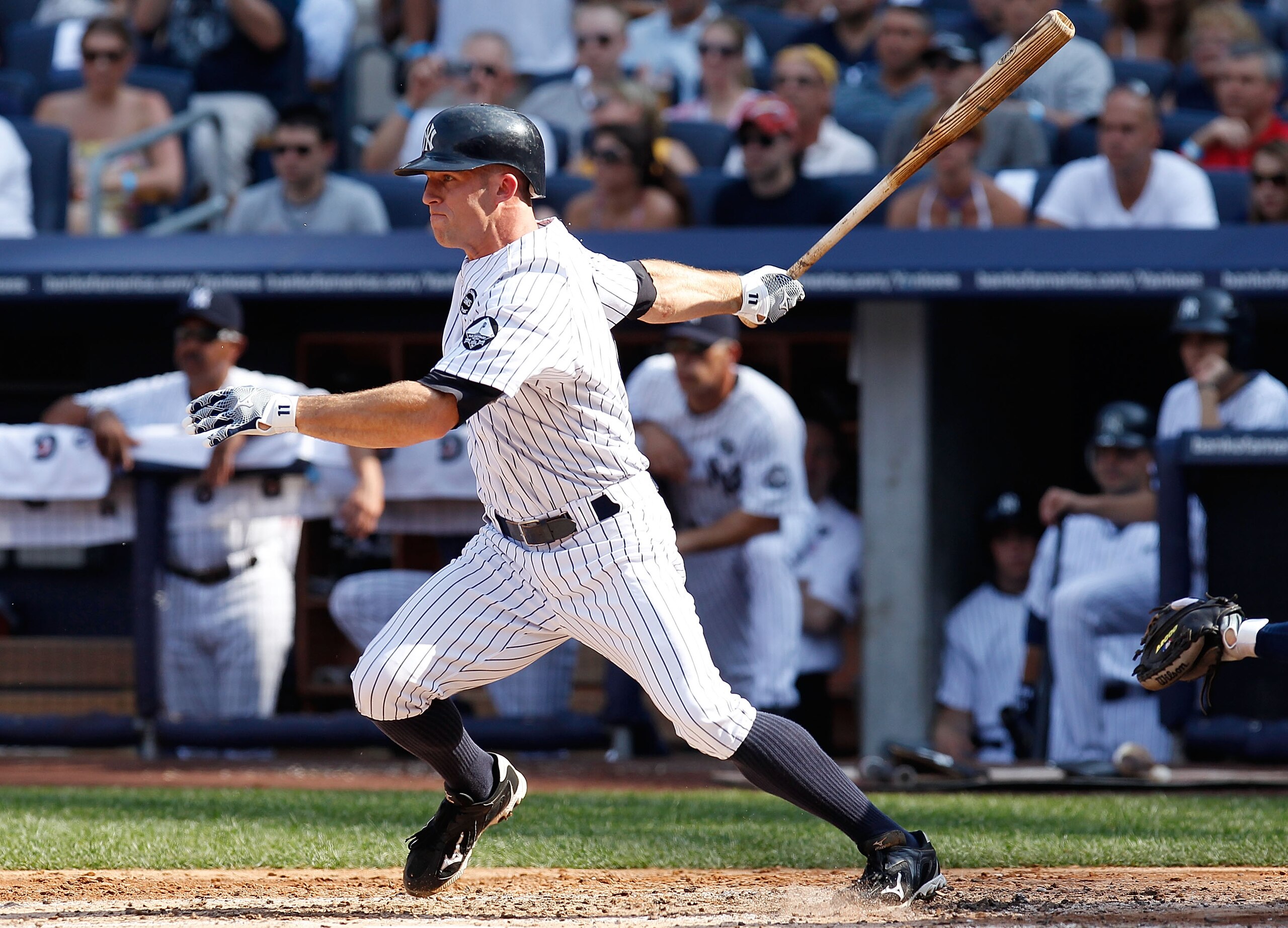 NEW YORK - JULY 17:  Brett Gardner #11 of the New York Yankees hits a two run single in the second-inning against the Tampa Bay Rays on July 17, 2010 at Yankee Stadium in the Bronx borough of New York City. (Photo by Mike Stobe/Getty Images)