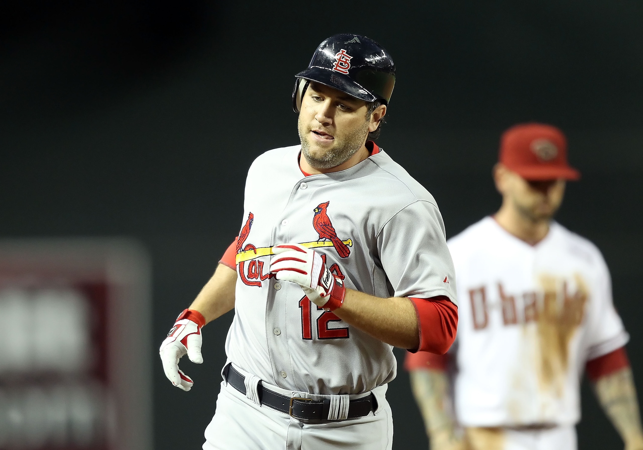 PHOENIX, AZ - APRIL 12:  Lance Berkman #12 of the St. Louis Cardinals rounds the bases after hitting a solo home run against the Arizona Diamondbacks during the second inning of the Major League Baseball game at Chase Field on April 12, 2011 in Phoenix, A