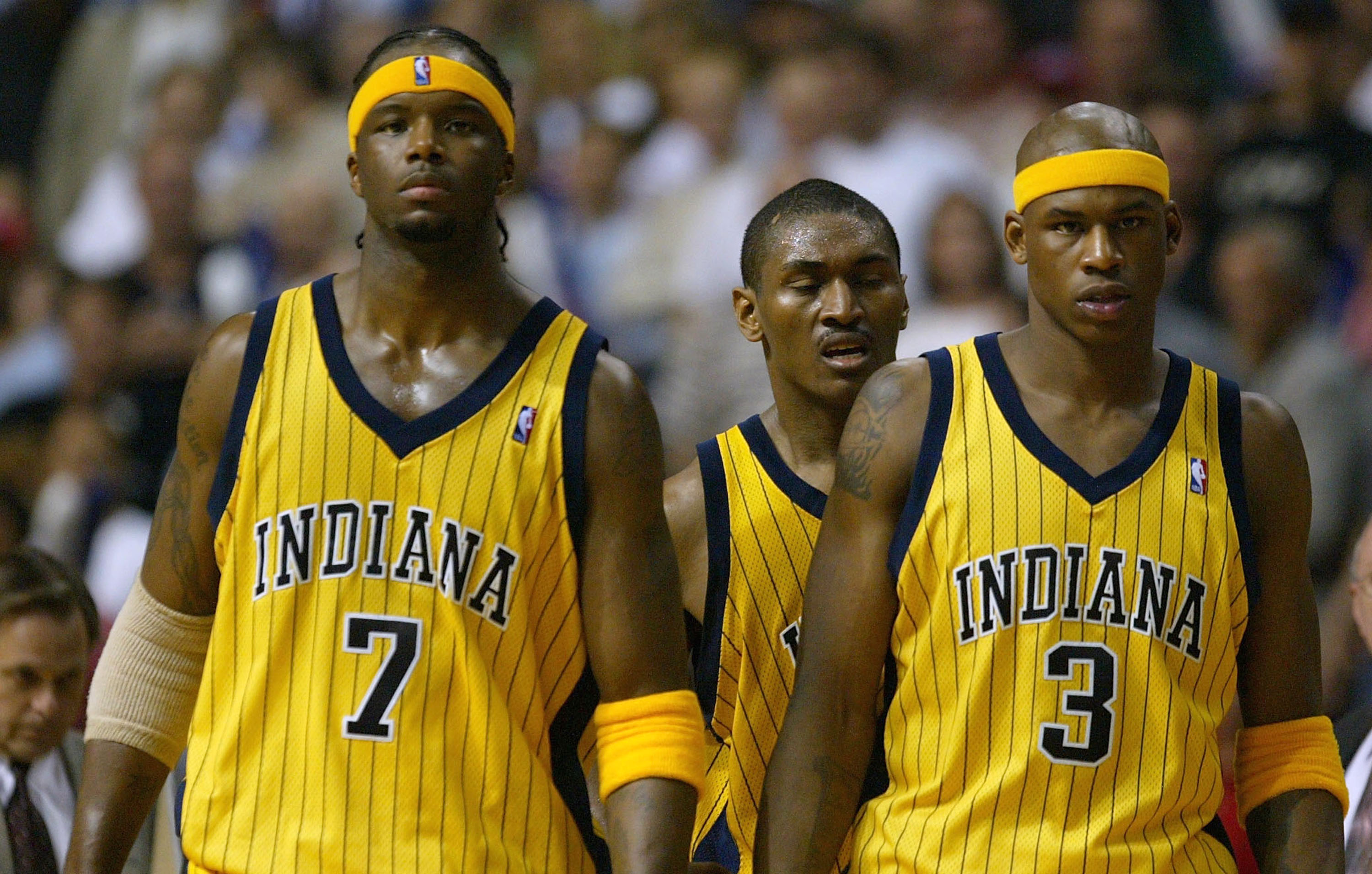 AUBURN HILLS, MI - JUNE 1: (L-R) Jermaine O'Neal #7, Ron Artest #23 and Al Harrington #3 of the Indiana Pacers look on after Artest committed a flagrant foul on Richard Hamilton #32 of the Detroit Pistons in Game six of the Eastern Conference Finals durin