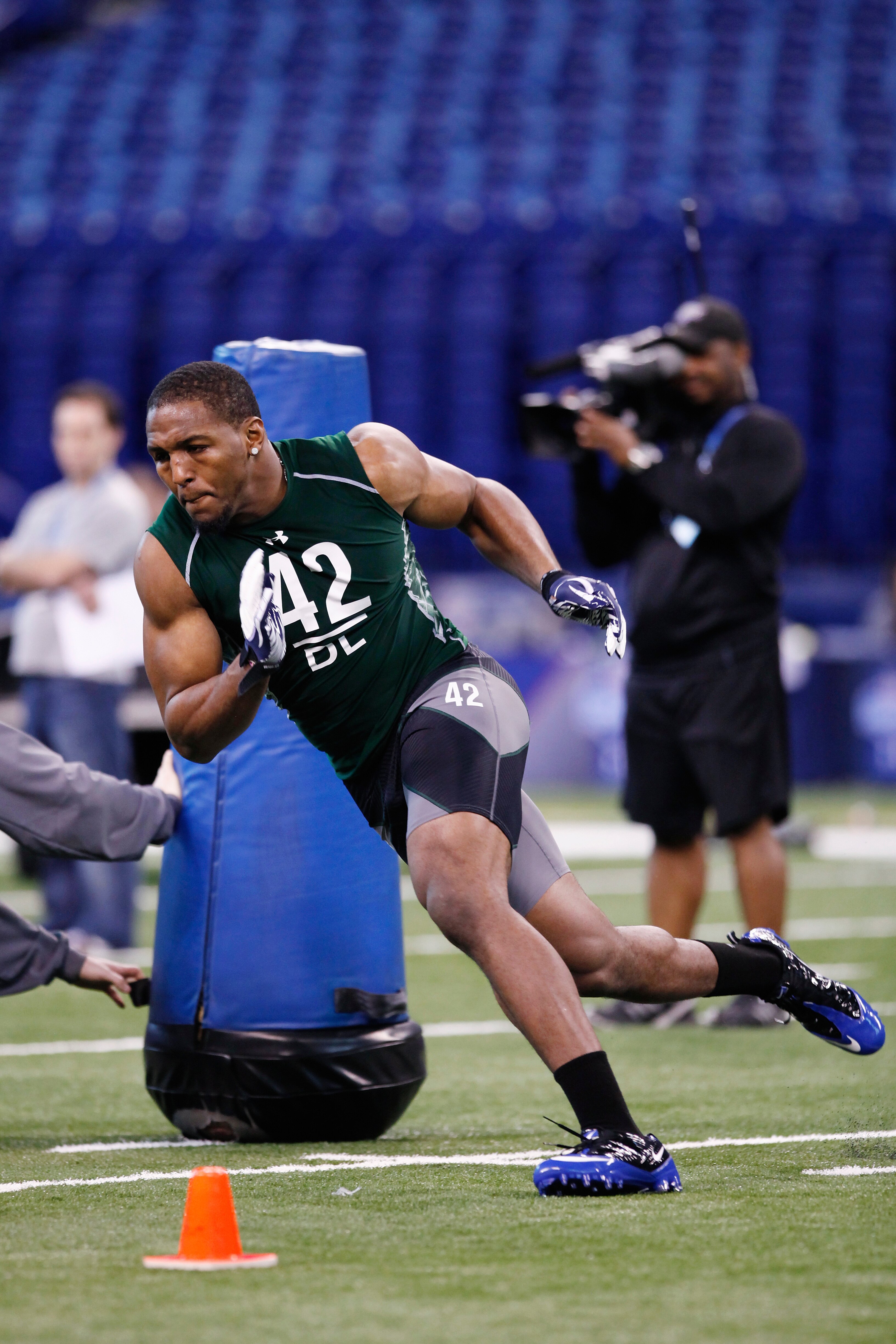 INDIANAPOLIS, IN - FEBRUARY 28: Defensive lineman Robert Quinn of North Carolina runs through a drill during the 2011 NFL Scouting Combine at Lucas Oil Stadium on February 28, 2011 in Indianapolis, Indiana. (Photo by Joe Robbins/Getty Images) INDIANAPOLIS, IN - FEBRUARY 28: Defensive lineman Robert Quinn of North Carolina runs through a drill during the 2011 NFL Scouting Combine at Lucas Oil Stadium on February 28, 2011 in Indianapolis, Indiana. (Photo by Joe Robbins/Getty Images)