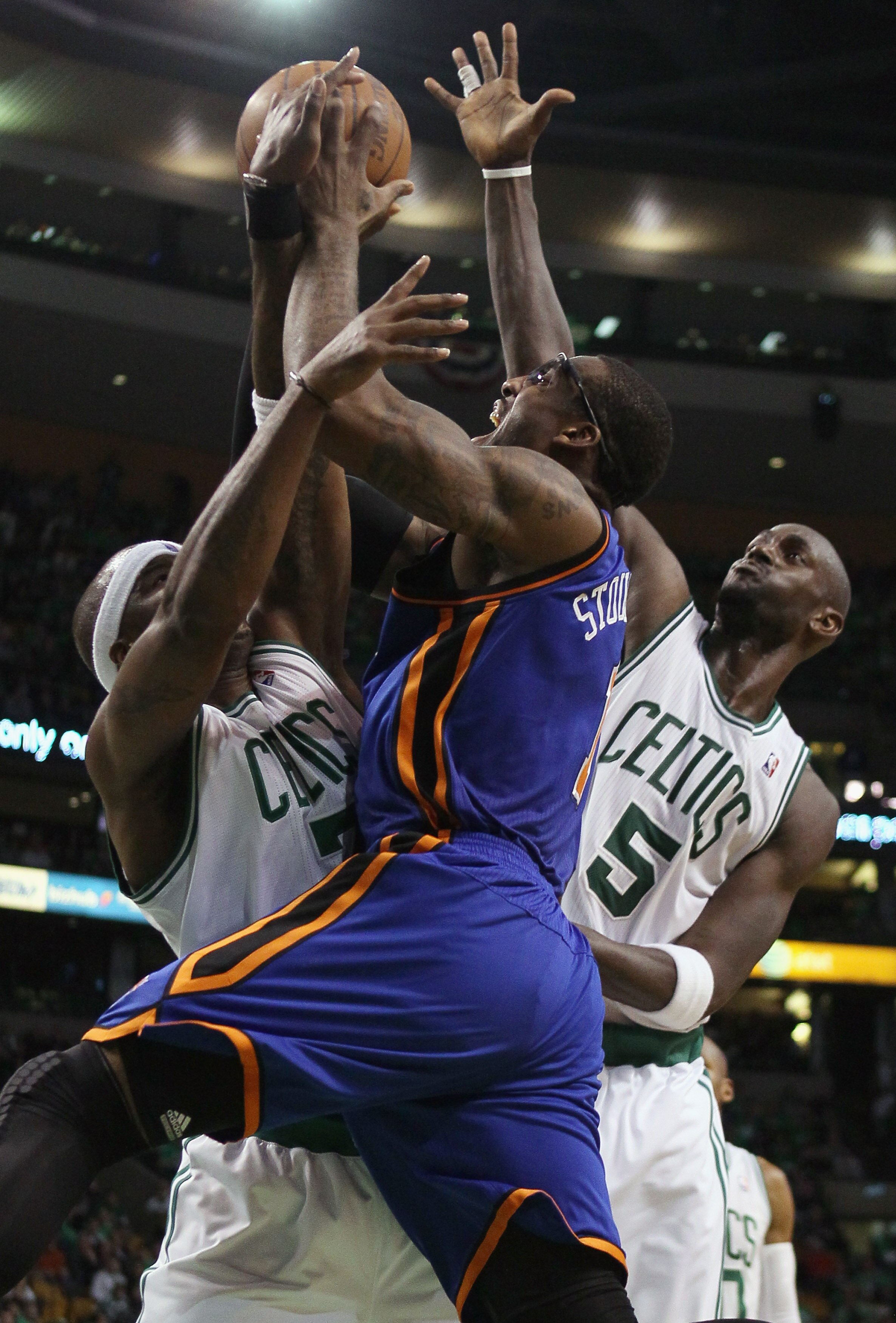 BOSTON, MA - APRIL 17:  Amare Stoudemire #1 of the New York Knicks triest to shoot around Jermaine O'Neal #7 and Kevin Garnett #5 of the Boston Celtics  in Game One of the Eastern Conference Quarterfinals in the 2011 NBA Playoffs on April 17, 2011 at the 