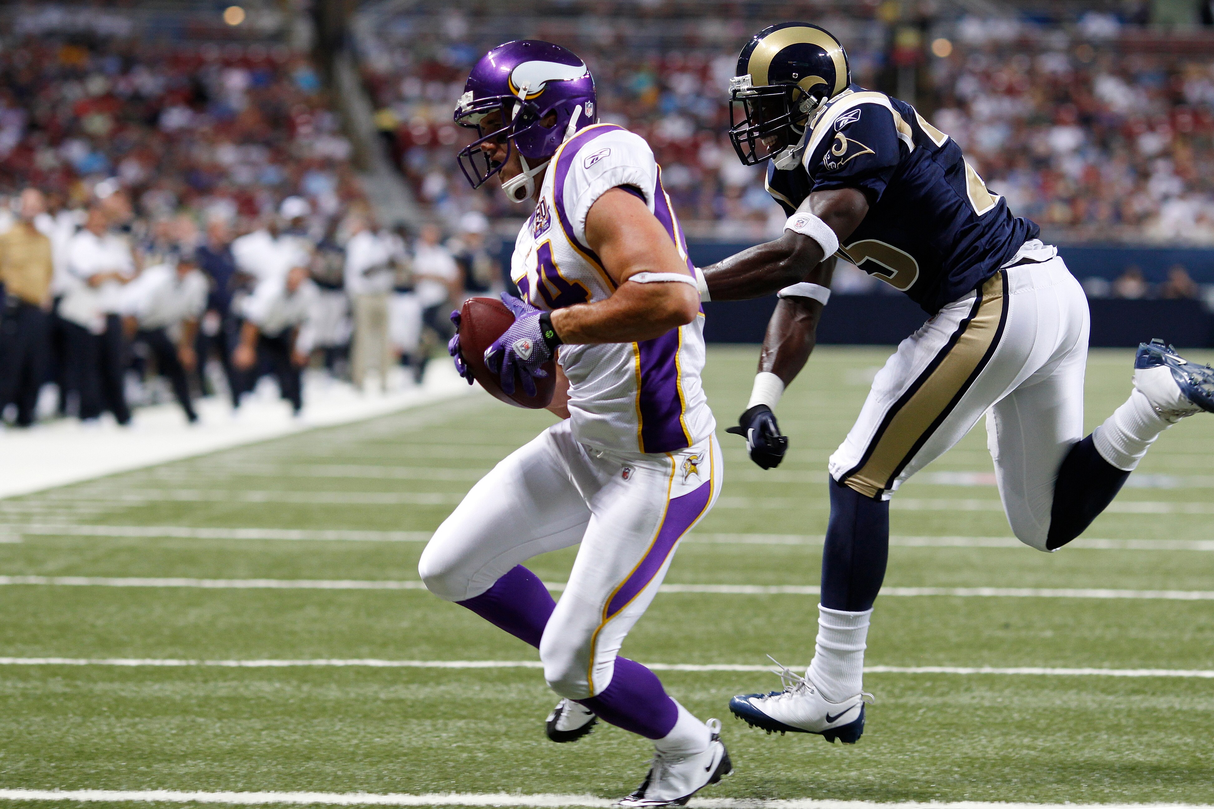 ST. LOUIS, MO - AUGUST 14: Logan Payne #84 of the Minnesota Vikings catches a touchdown pass against Marquis Johnson #25 of the St. Louis Rams during the preseason game at Edward Jones Dome on August 14, 2010 in St. Louis, Missouri. (Photo by Joe Robbins/