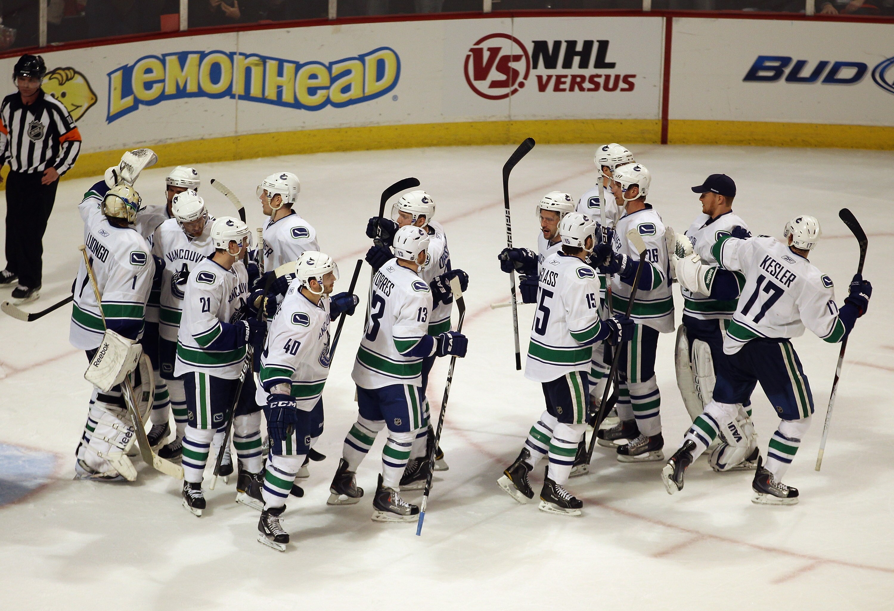 CHICAGO, IL - APRIL 17: Members of the Vancouver Canucks including Roberto Luongo #1 (L), Mason Raymond #21, Maxim Lapierre #40 and Raffi Torres #13 celebrate a win over the Chicago Blackhawks in Game Three of the Western Conference Quarterfinals during t
