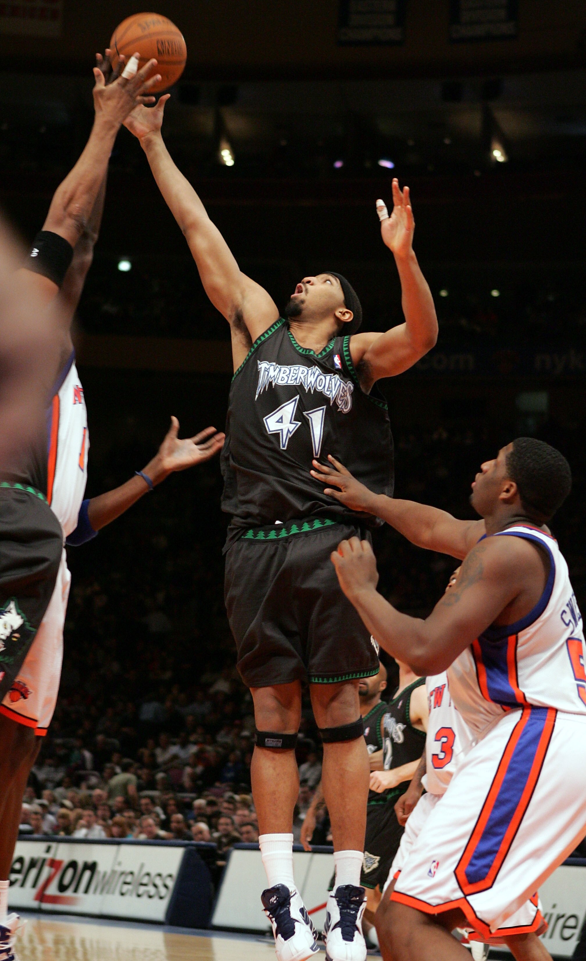 NEW YORK - DECEMBER 29: Eddie Griffin #41of the Minnesota Timberwolves reaches for the ball against Michael Sweetney #50 of the New York Knicks during thier game on December 29, 2004 at Madison Square Garden in New York City.  NOTE TO USER:  User expressl