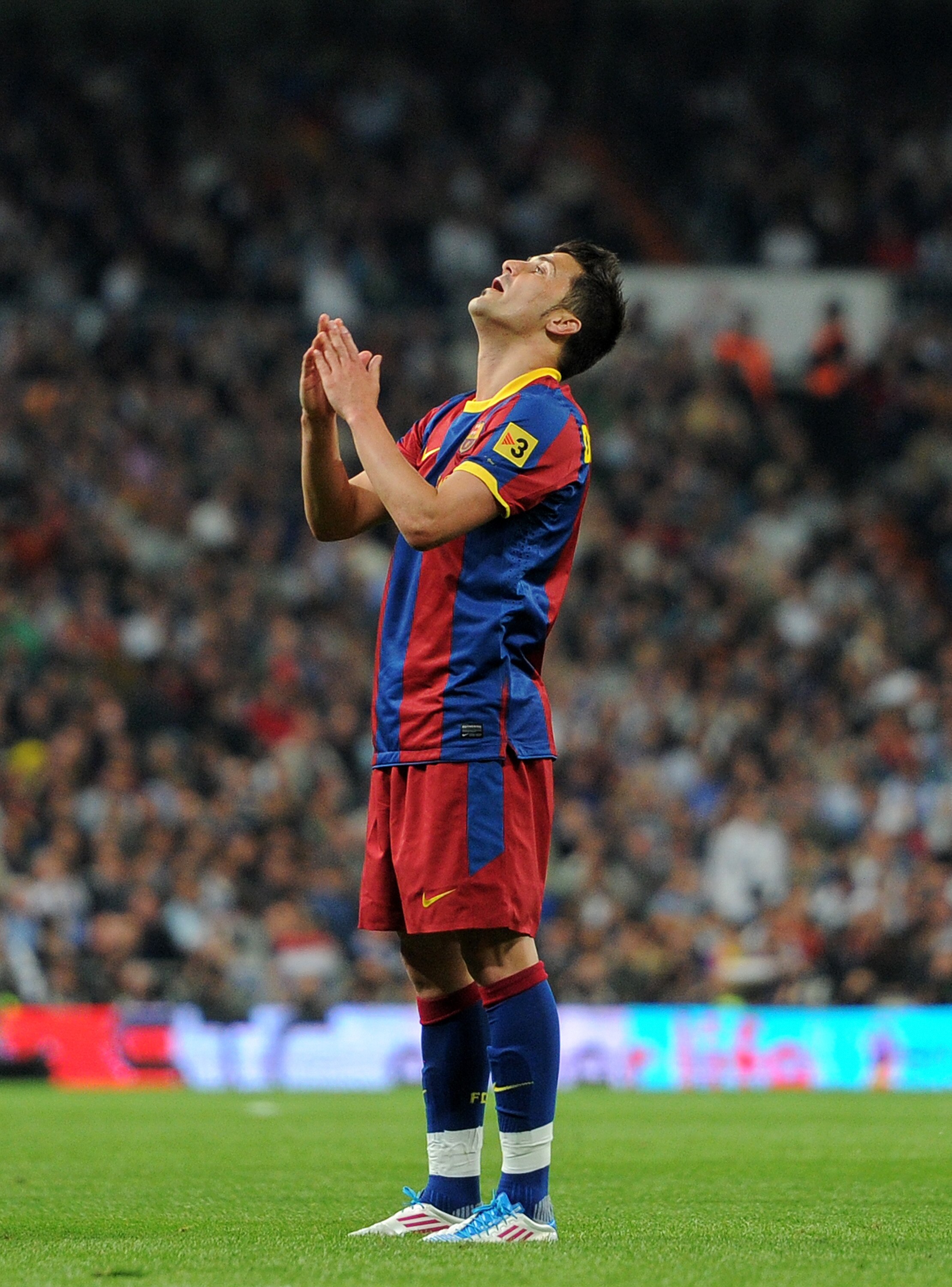 MADRID, SPAIN - APRIL 16:  David Villa of Barcelona reacts after failing to score during the la Liga match between Real Madrid and Barcelona at Estadio Santiago Bernabeu on April 16, 2011 in Madrid, Spain.  (Photo by Jasper Juinen/Getty Images)