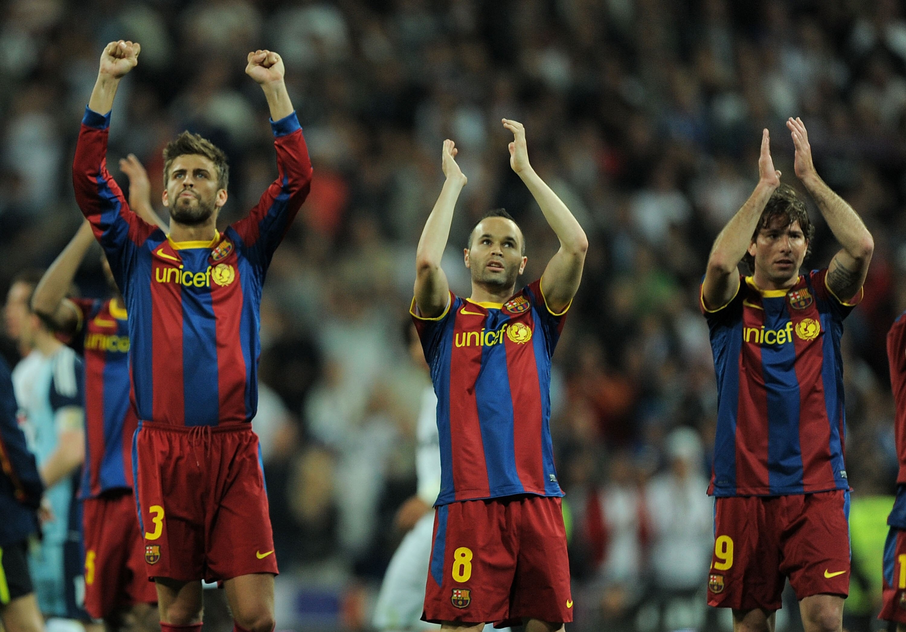 MADRID, SPAIN - APRIL 16:  Gerard Pique (L) Andres Iniesta (C) and Maxwell Scherrer of Barcelona applaud after drawing 1-1 against Real Madrid  during the La Liga match between Real Madrid and Barcelona at Estadio Santiago Bernabeu on April 16, 2011 in Ma