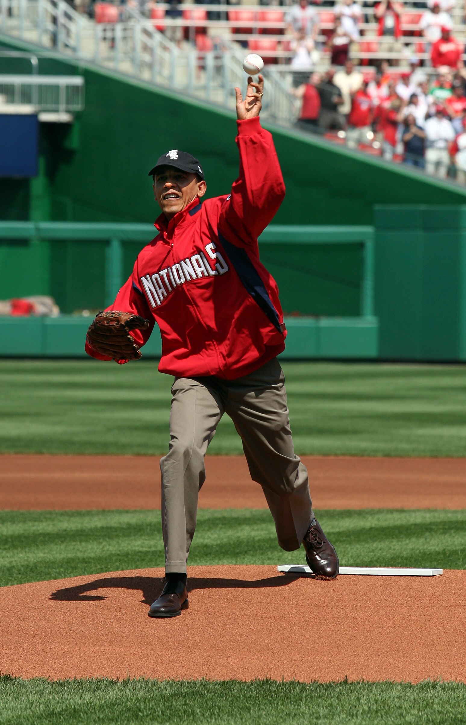 WASHINGTON - APRIL 05:  U.S. President Barack Obama throws out the opening pitch before the game between the Philadelphia Phillies and the Washington Nationals on Opening Day at Nationals Park on April 5, 2010 in Washington, DC.  (Photo by Martin H. Simon