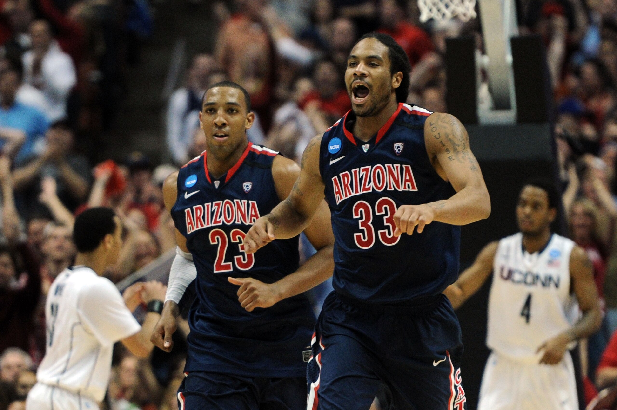 ANAHEIM, CA - MARCH 26:  Jesse Perry #33 of the Arizona Wildcats celebrates after scoring against the Connecticut Huskies during the west regional final of the 2011 NCAA men's basketball tournament at the Honda Center on March 26, 2011 in Anaheim, Califor
