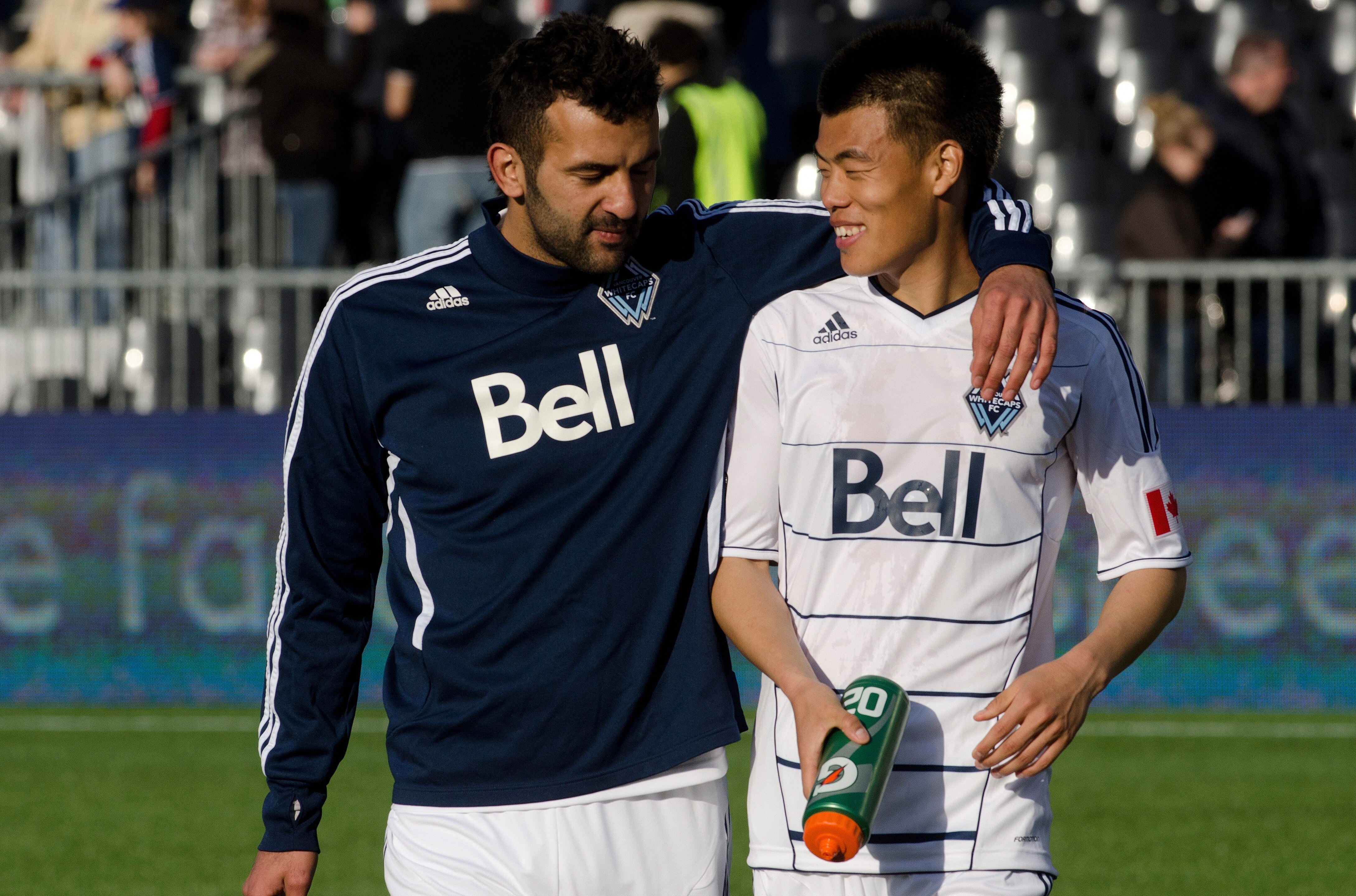 VANCOUVER, CANADA - APRIL 16: Mouloud Akloul #50 and Long Tan #23 of the Vancouver Whitecaps FC walk off the field after playing to a draw against the Chivas USA in MLS action on April 16, 2011 at Empire Field in Vancouver, BC, Canada.  (Photo by Rich Lam