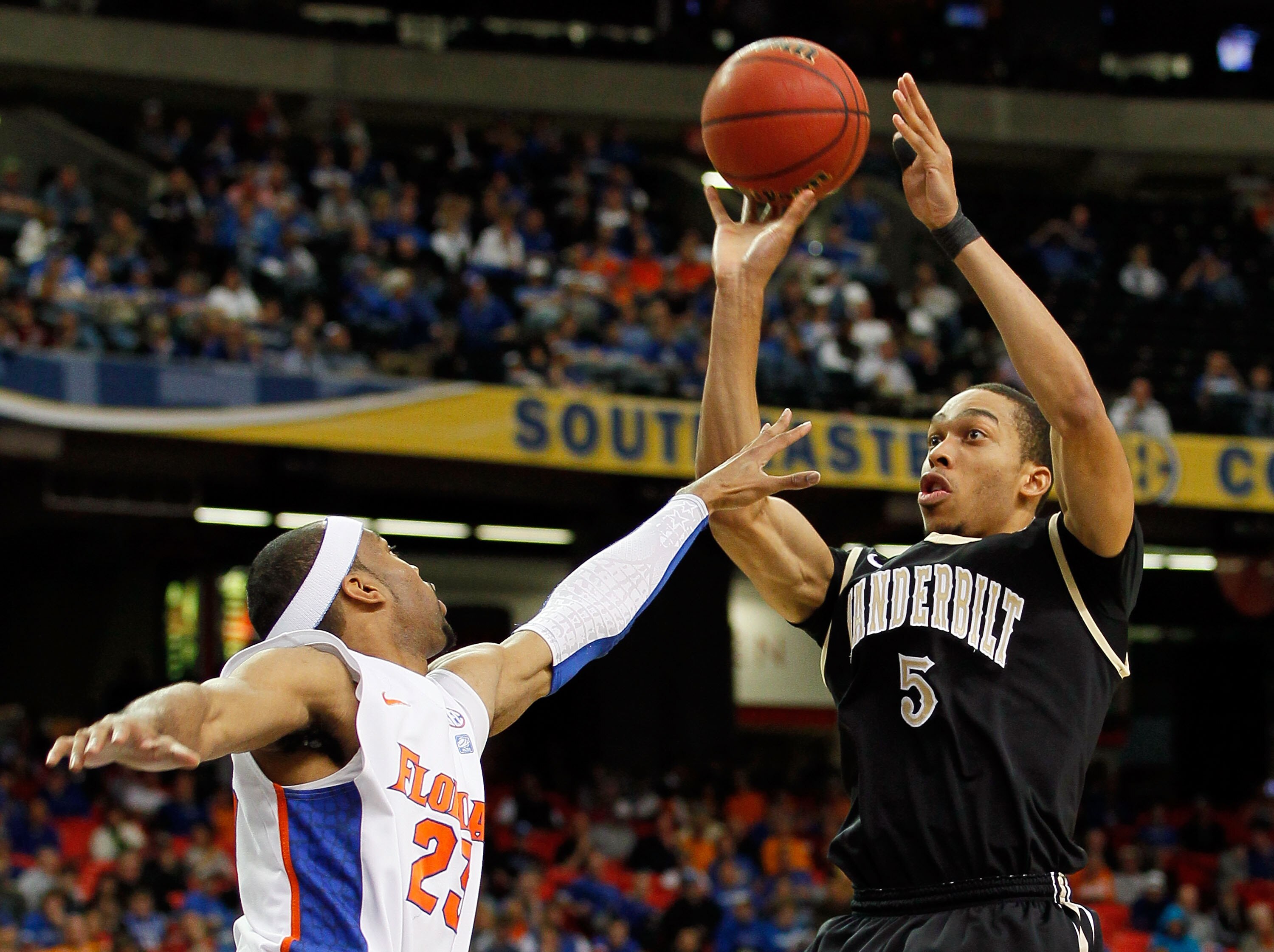 ATLANTA, GA - MARCH 12:  Lance Goulbourne #5 of the Vanderbilt Commodores shoots over Alex Tyus #23 of the Florida Gators during the semifinals of the SEC Men's Basketball Tournament at Georgia Dome on March 12, 2011 in Atlanta, Georgia.  (Photo by Kevin