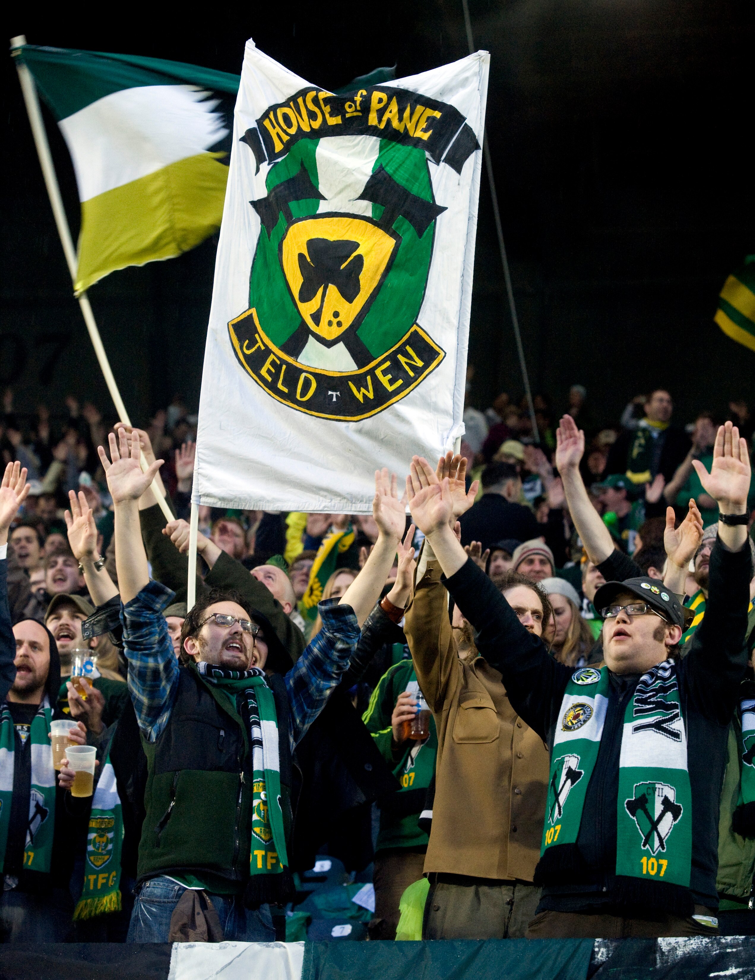 PORTLAND, OR - APRIL 14: Portland Timbers fans stand in the pouring rain as they cheer before the start of the teams home opening game at Jeld-Wen Field on April 14, 2011 in Portland, Oregon. (Photo by Steve Dykes/Getty Images)
