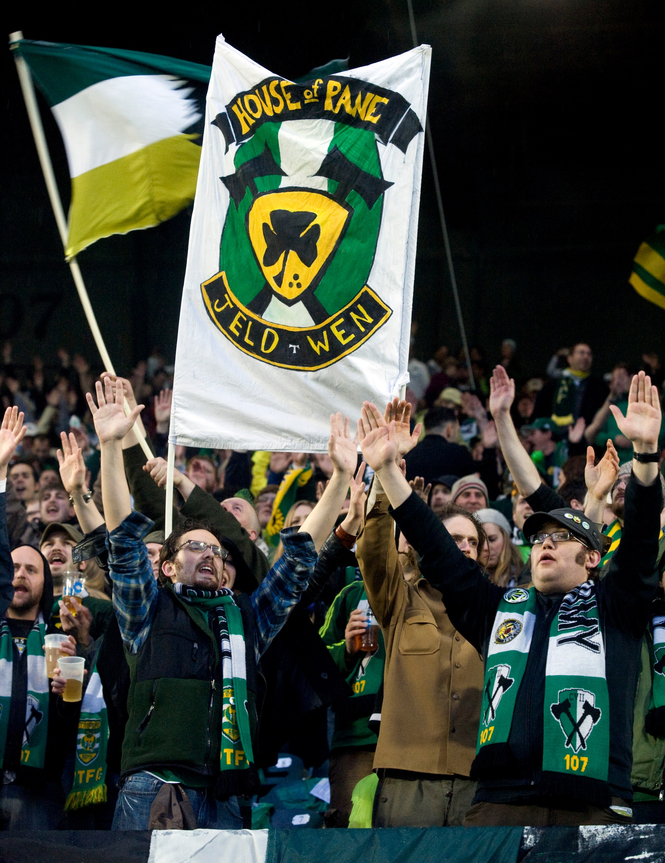 PORTLAND, OR - APRIL 14: Portland Timbers fans stand in the pouring rain as they cheer before the start of the teams home opening game at Jeld-Wen Field on April 14, 2011 in Portland, Oregon. (Photo by Steve Dykes/Getty Images)